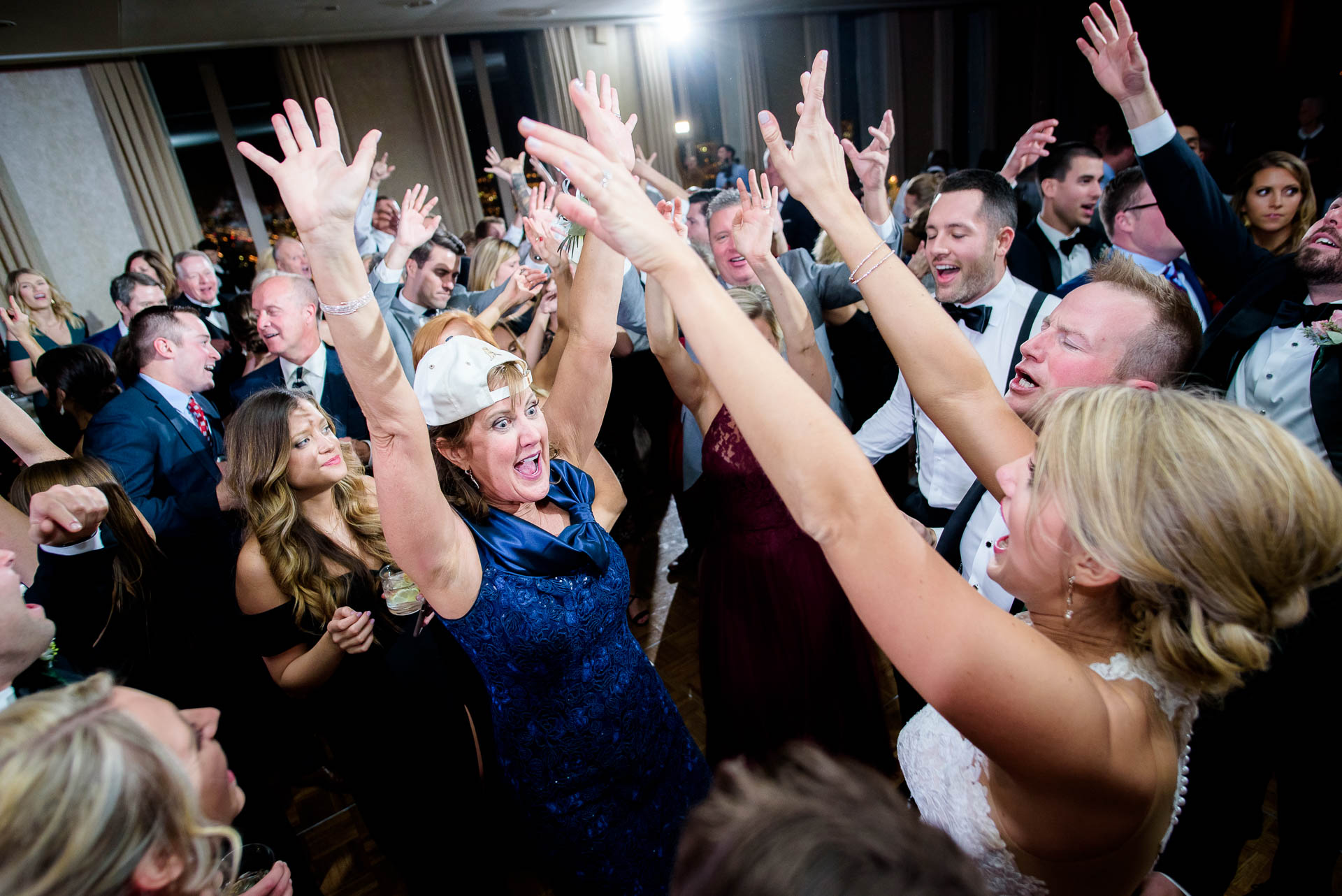 Packed dance floor during a wedding reception at the Mid America Club in Chicago.