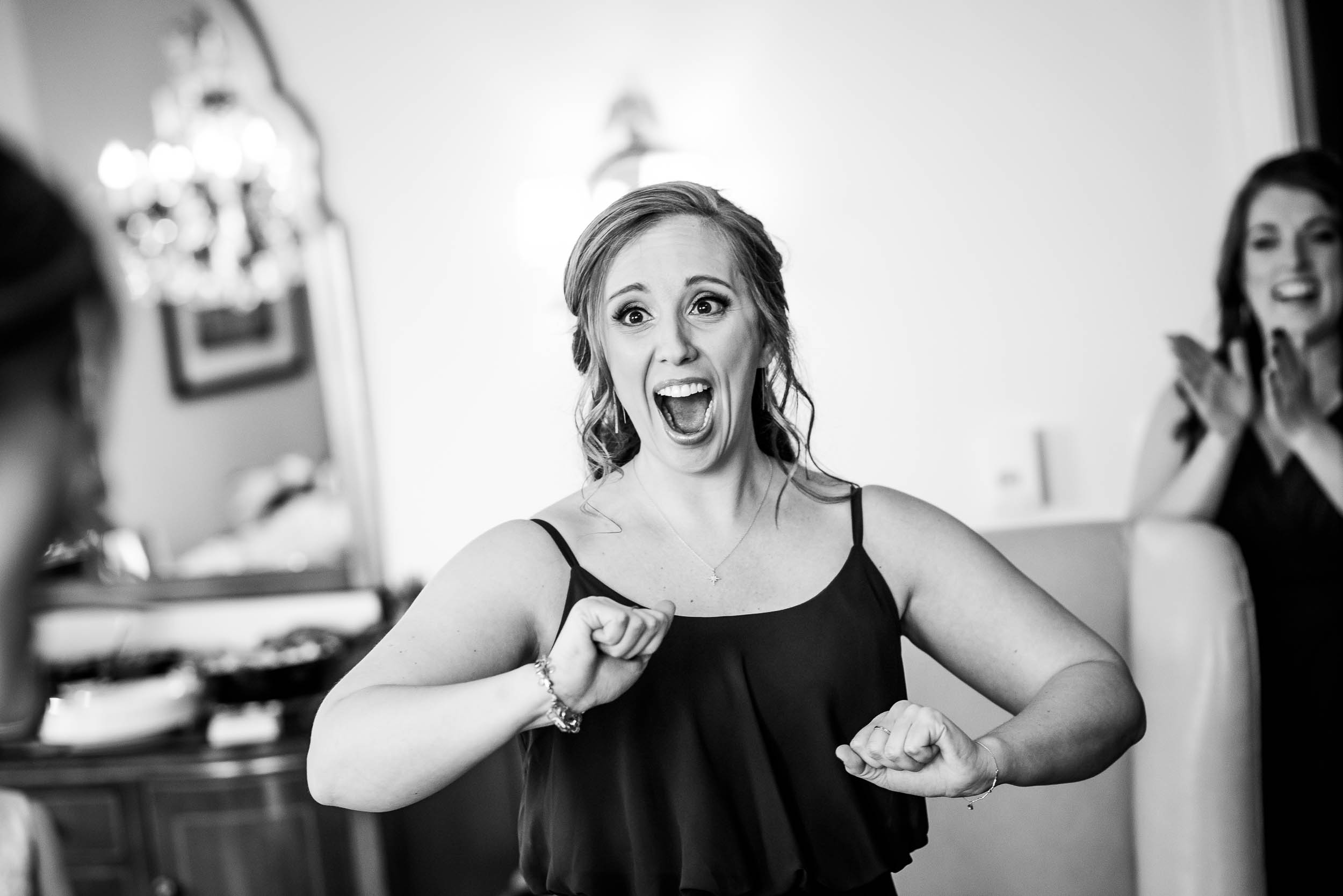 Maid of honor reacts to seeing the bride during a Blackstone Chicago wedding. 