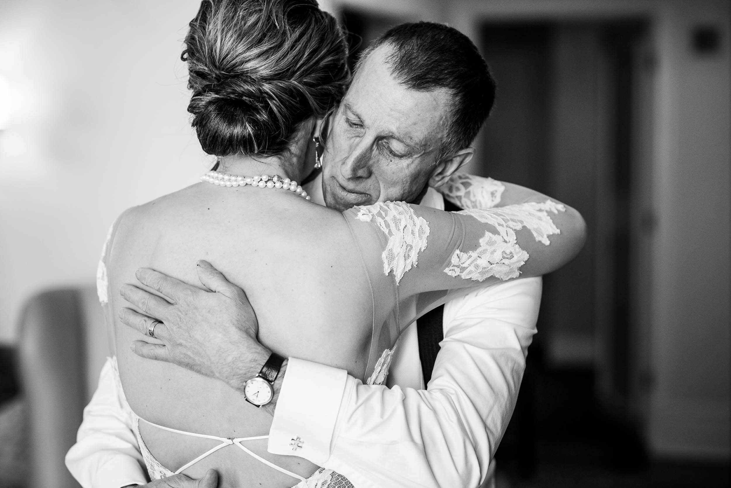 Father of the bride hugs his daughter during a Blackstone Chicago wedding.