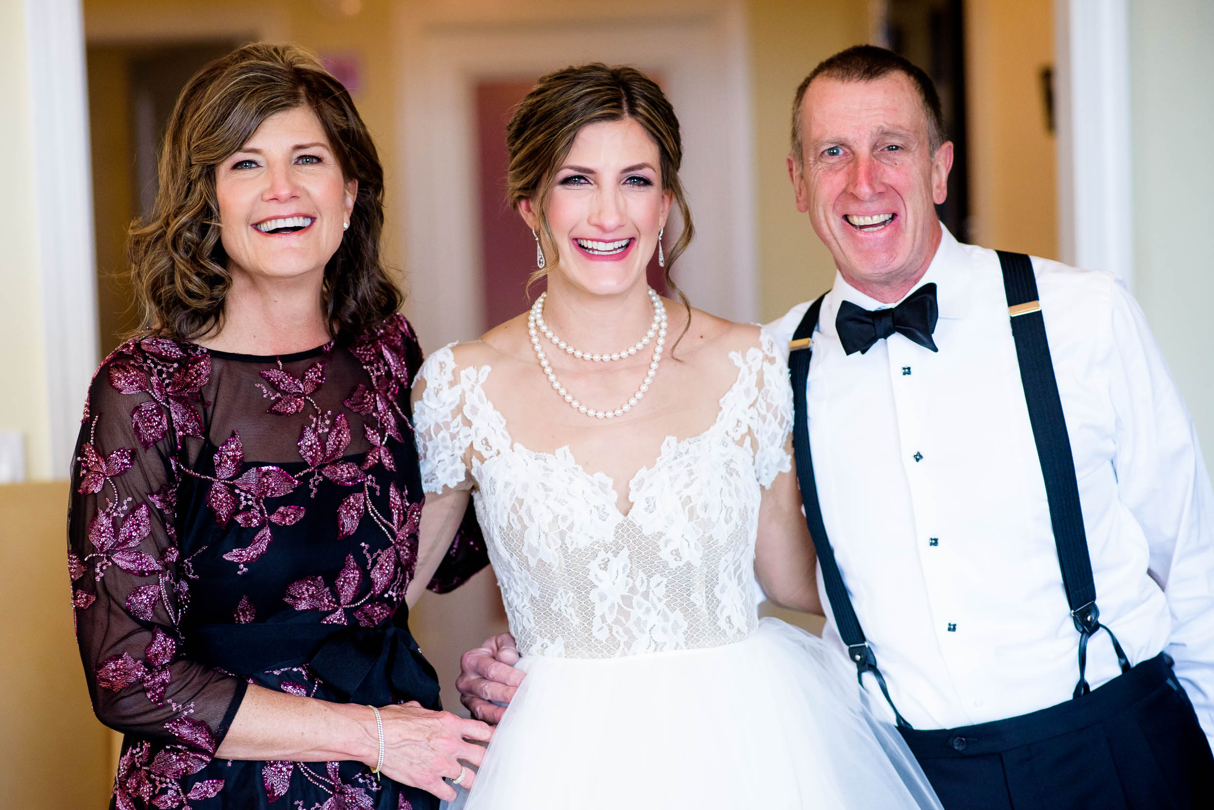 Bride with her parents during a Blackstone Chicago wedding.