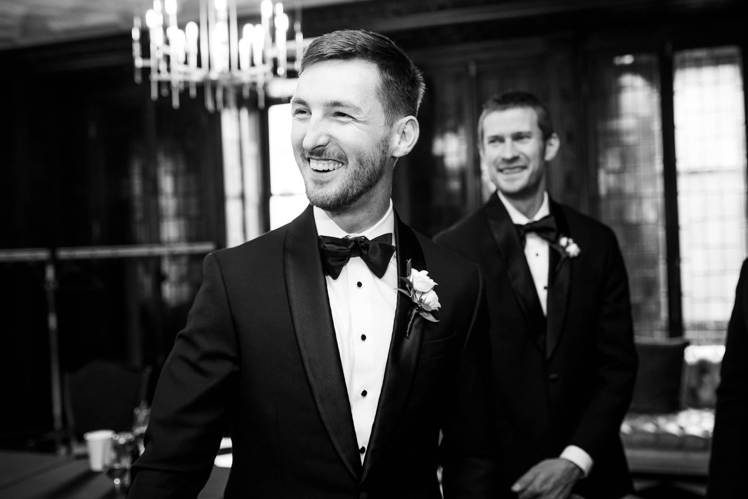 Groom shares a laugh with his friends during a Blackstone Chicago wedding.