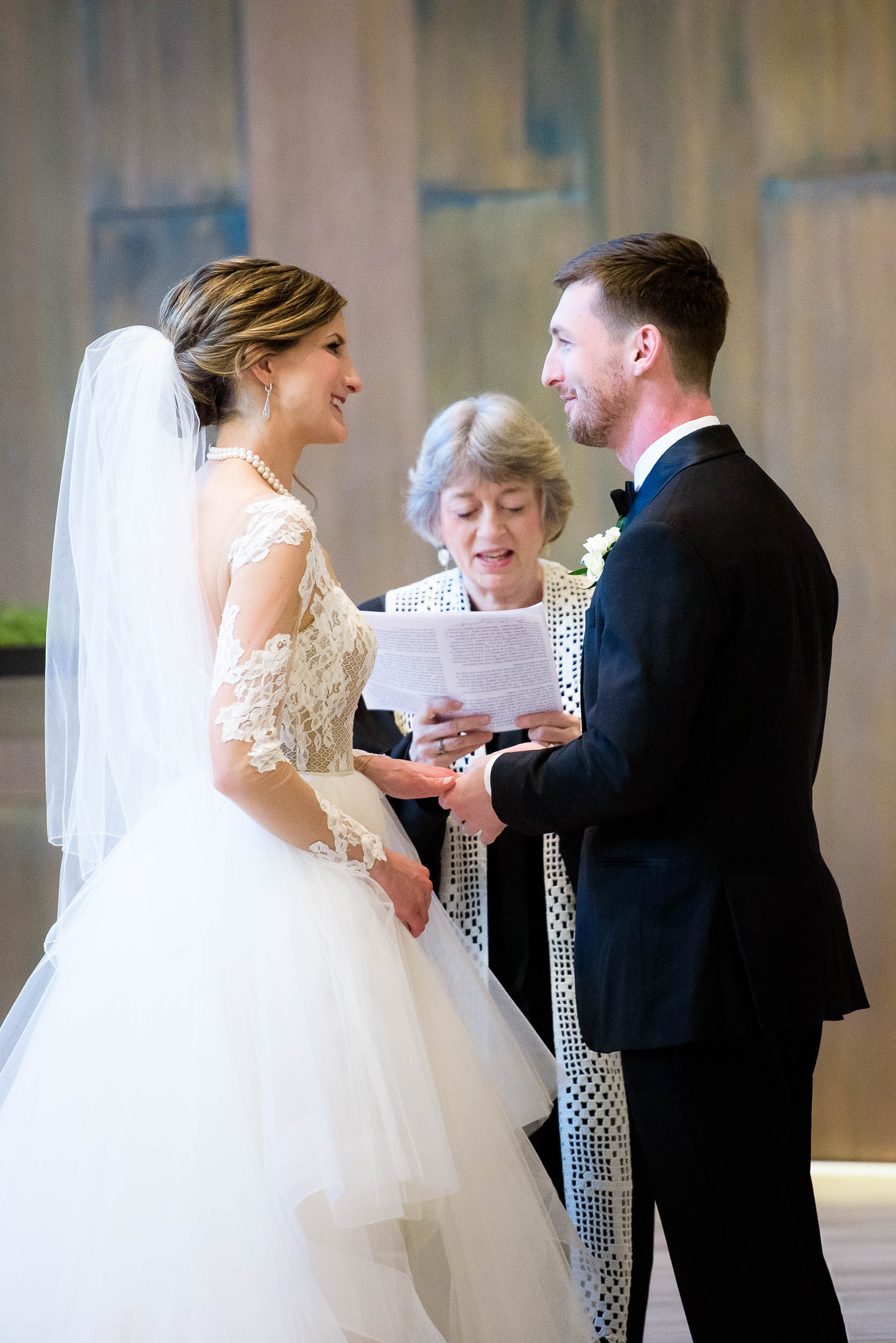 Exchange of rings during a Fourth Presbyterian Church wedding.