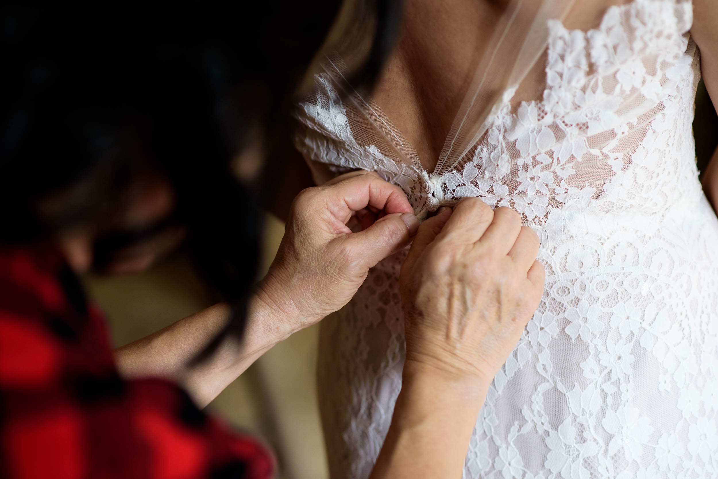 Mom helping the bride get ready before her Loft on Lake Chicago wedding.