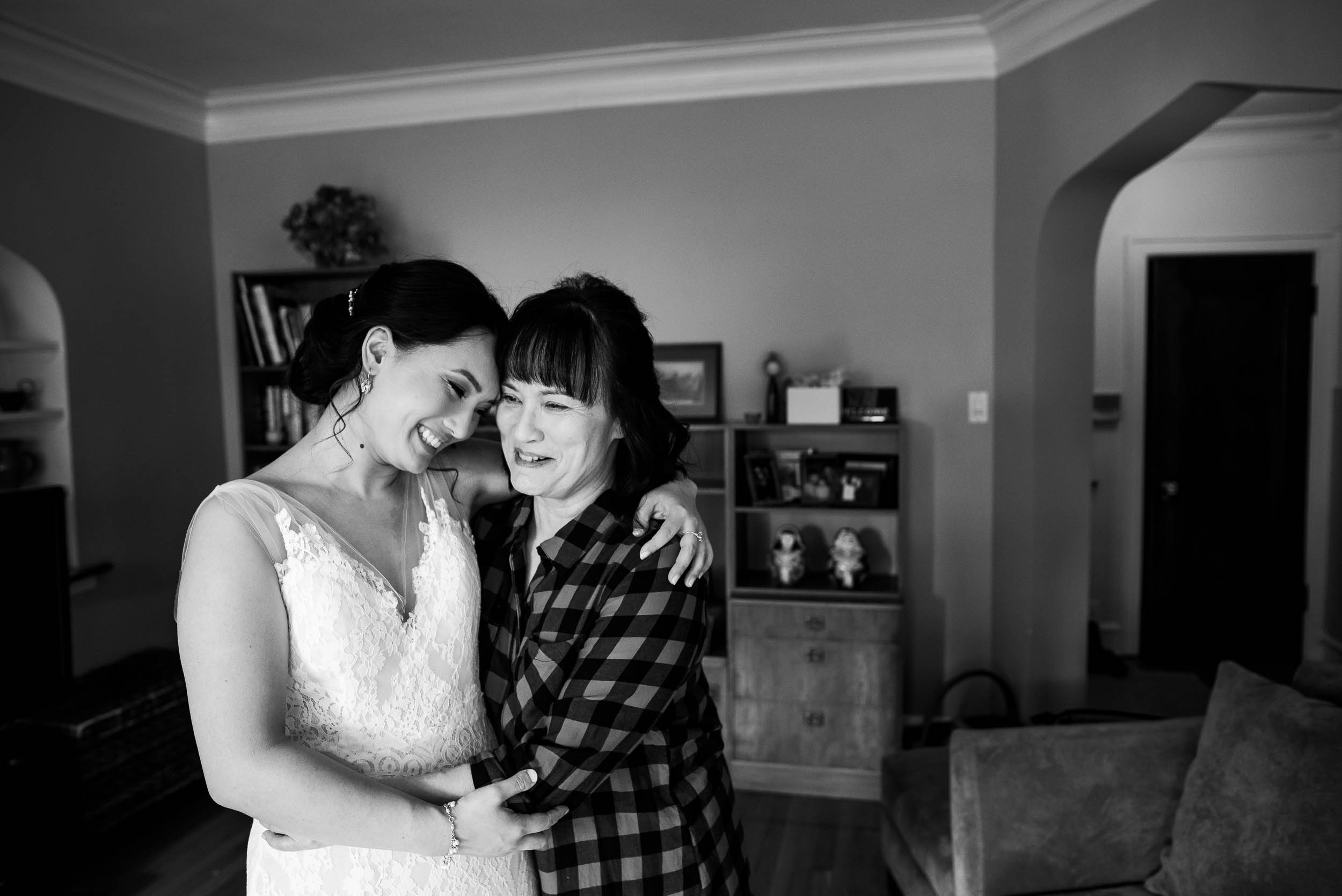 Mother and bride hug before a Loft on Lake Chicago wedding.