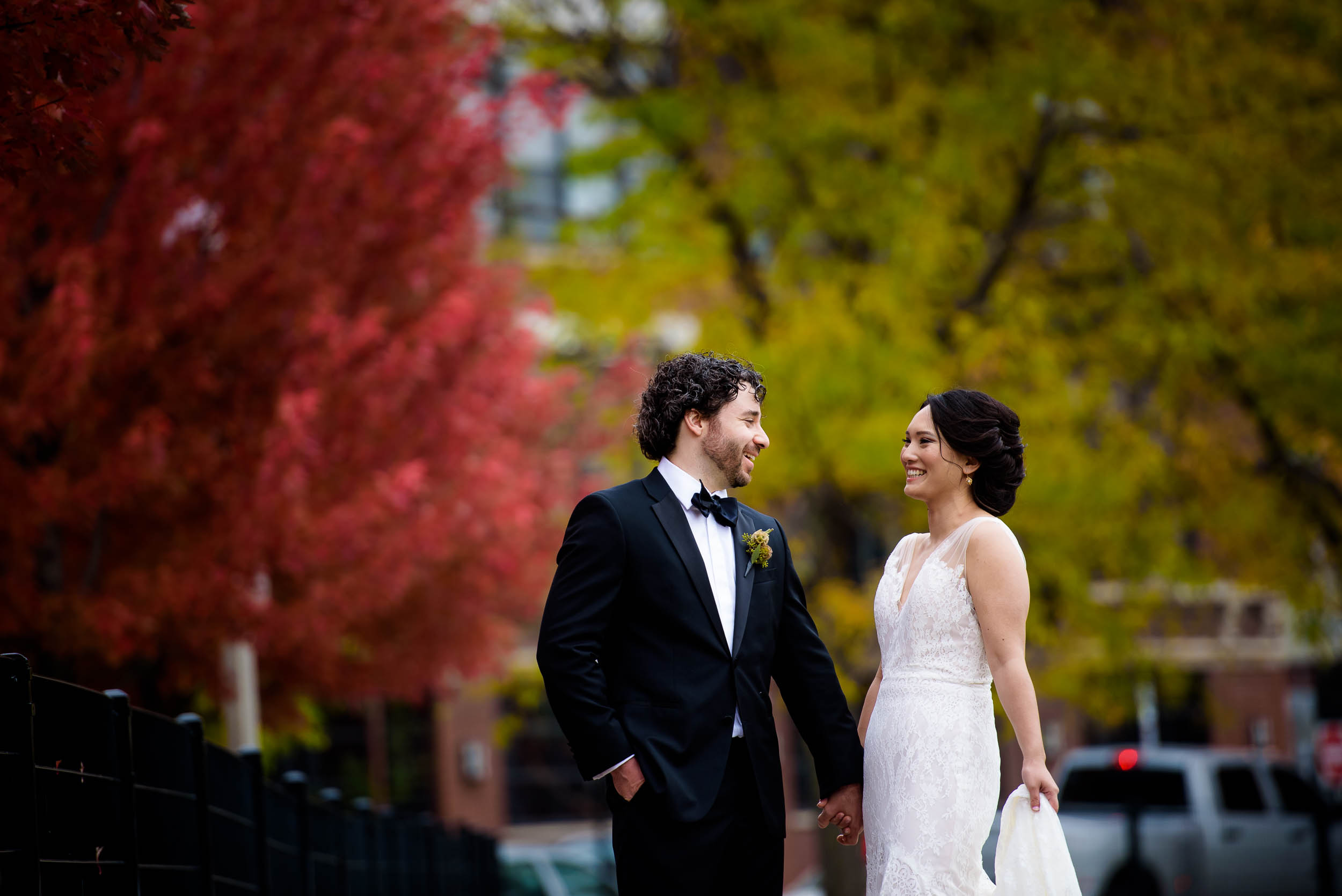 Bride and groom laugh together during their wedding photo session at Mary Bartelme Park Chicago.
