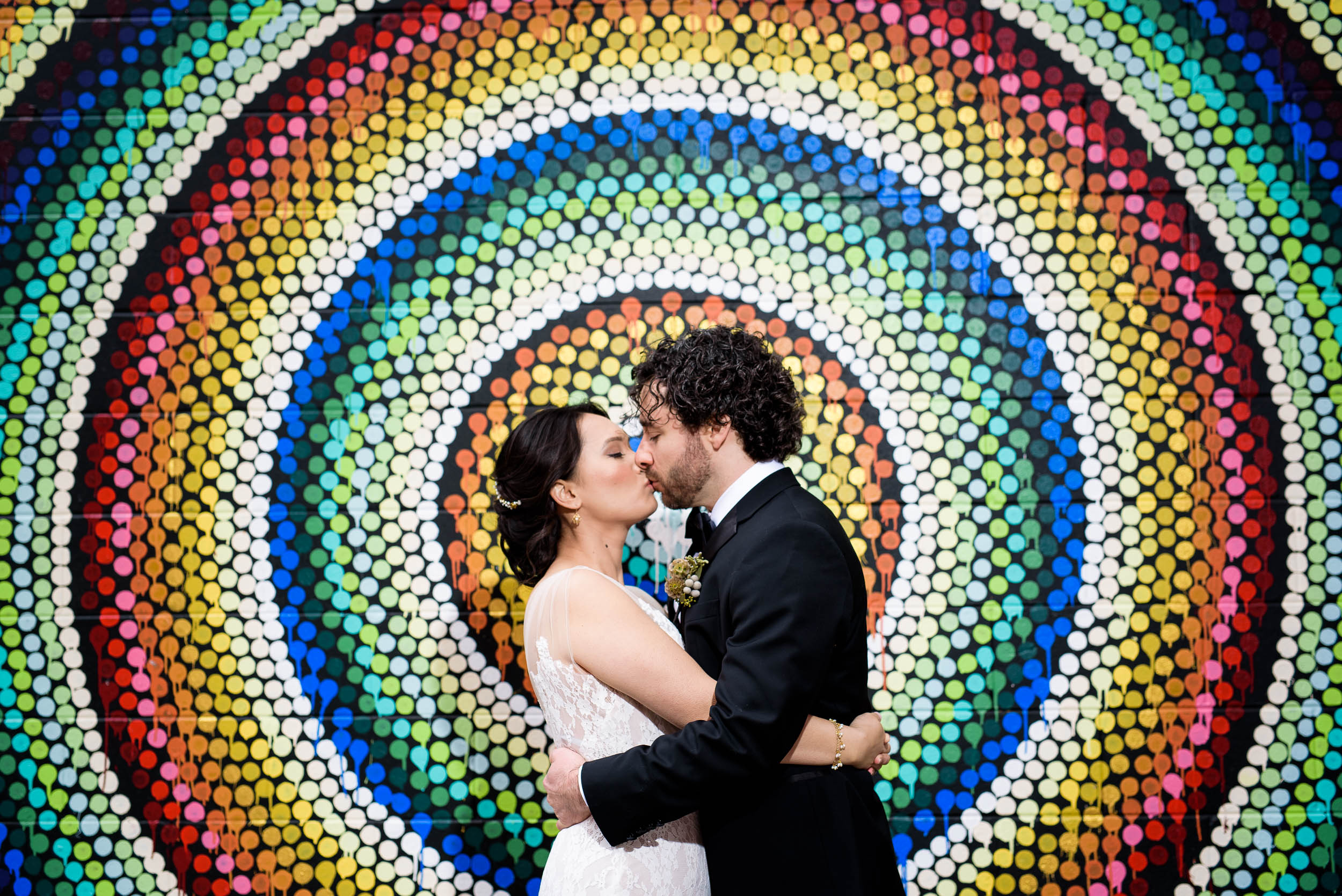 Creative photo of bride and groom with street art before their Loft on Lake Chicago wedding.