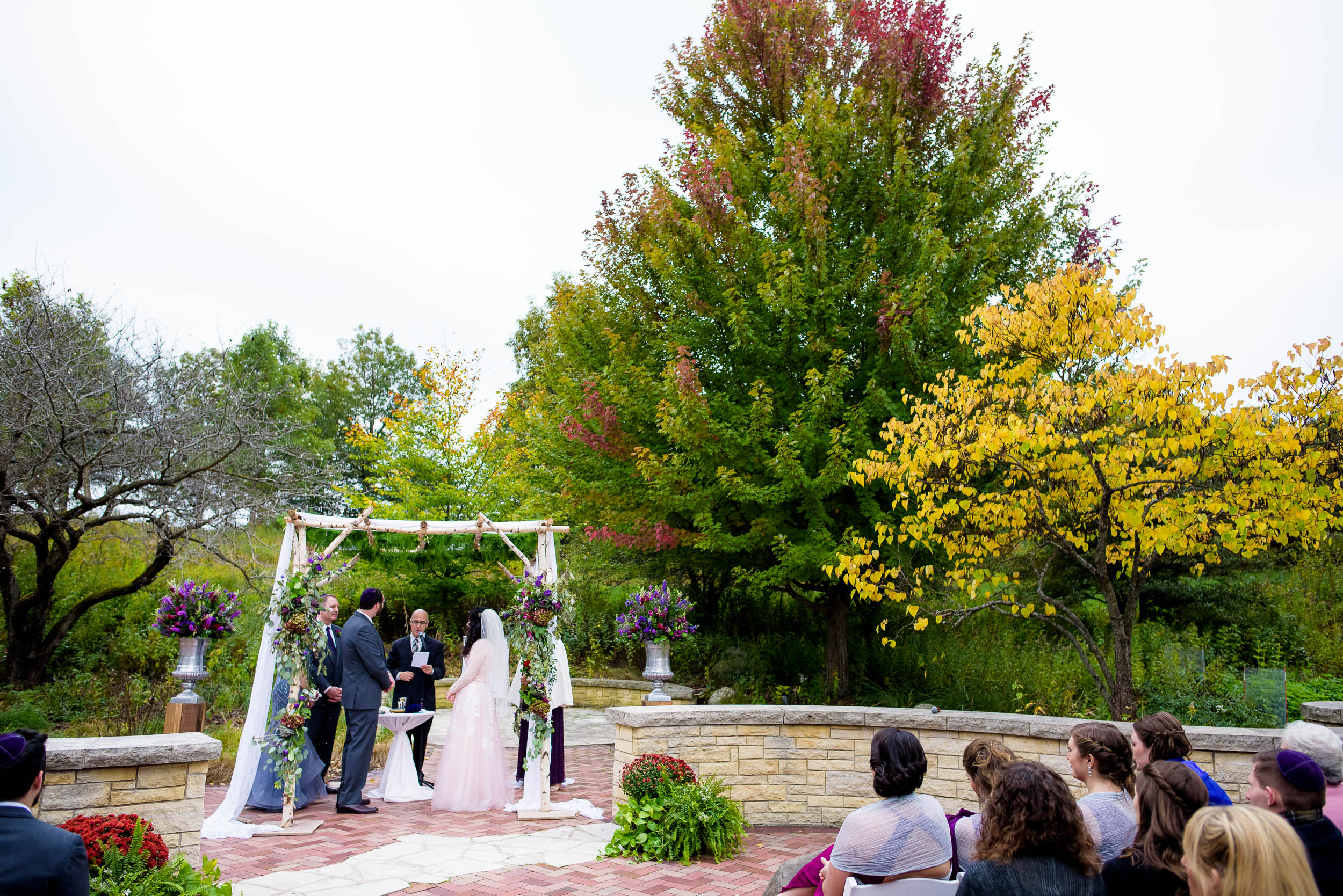 Fall colors outdoor Jewish ceremony during an Independence Grove Chicago wedding.  