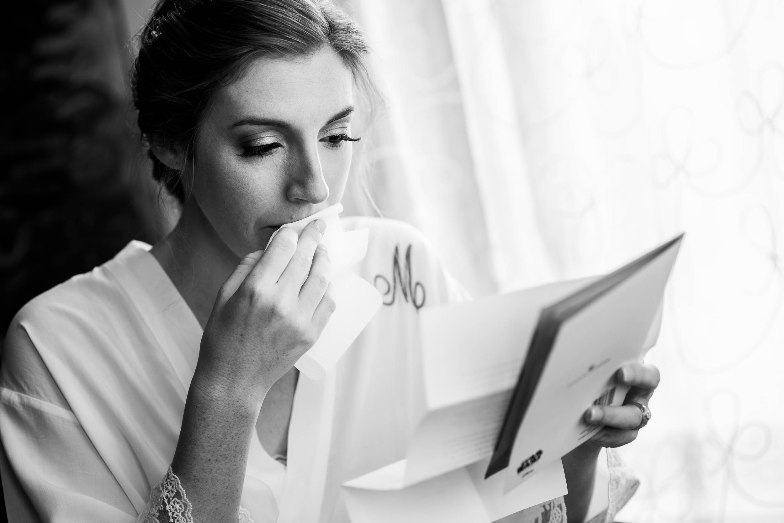 Bride reads a card from the groom during a Newberry Library Chicago wedding.