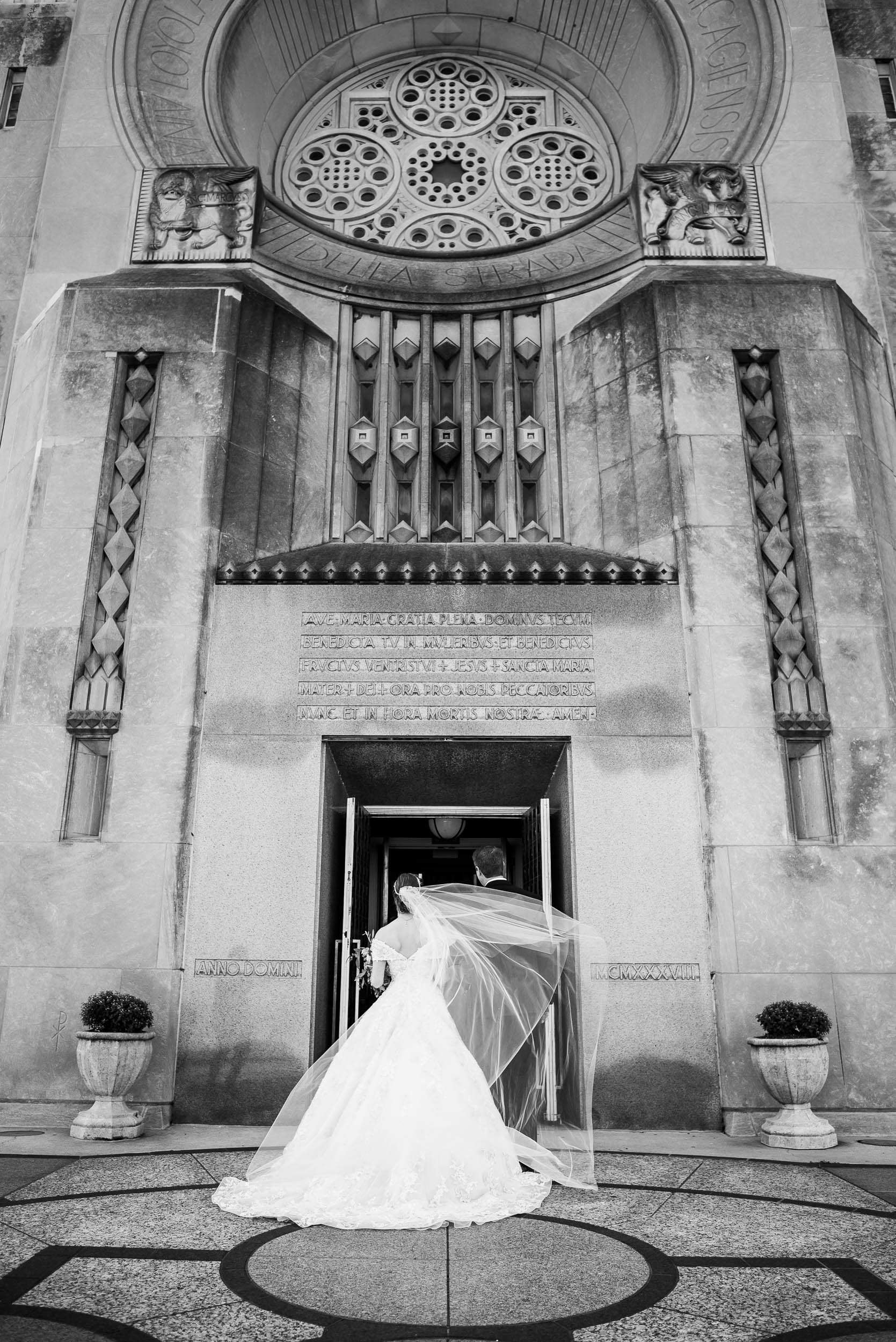 Father and bride enter Madonna Della Strada for her wedding ceremony in Chicago.