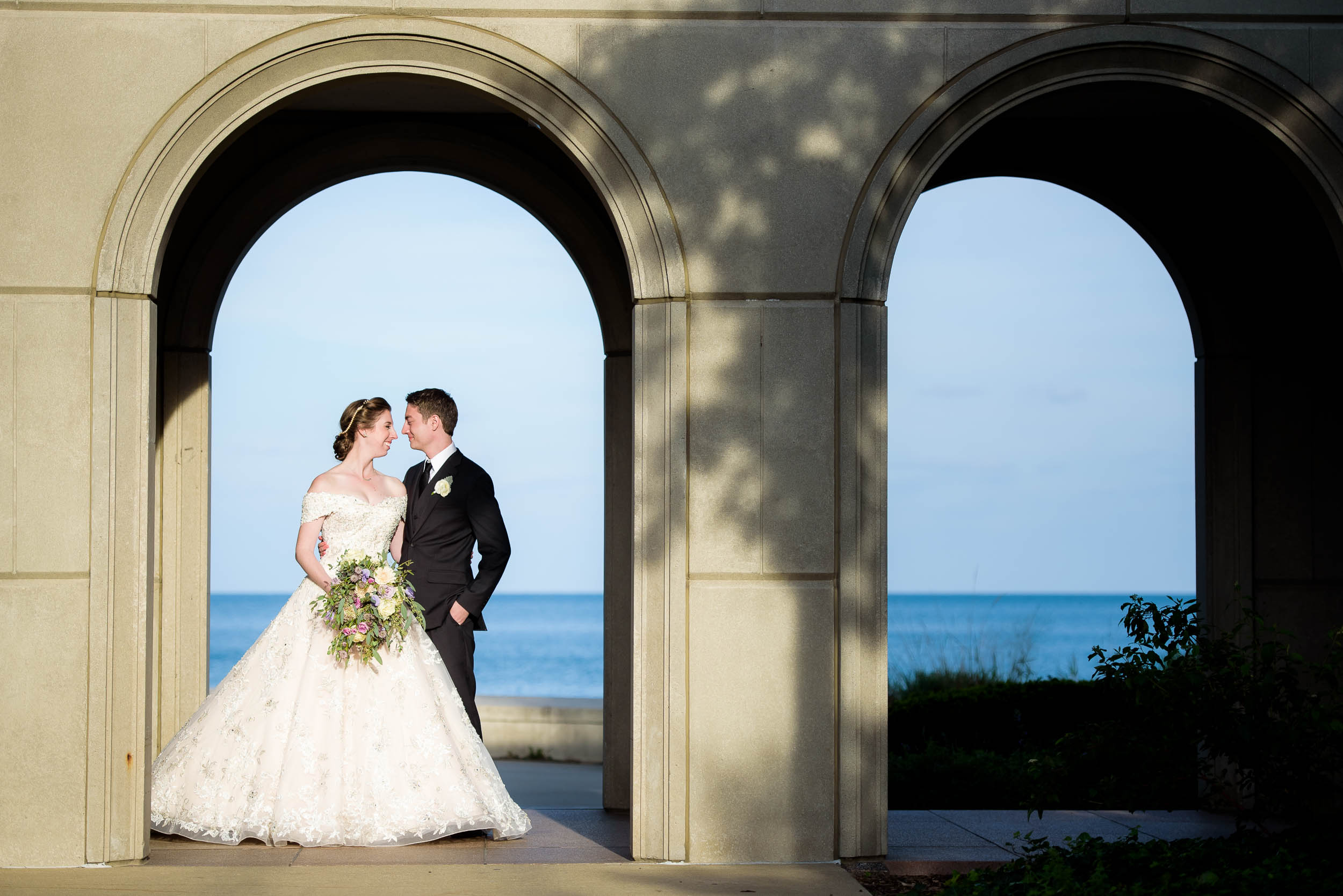 Wedding day portrait of the bride and groom on Loyola’s Campus.