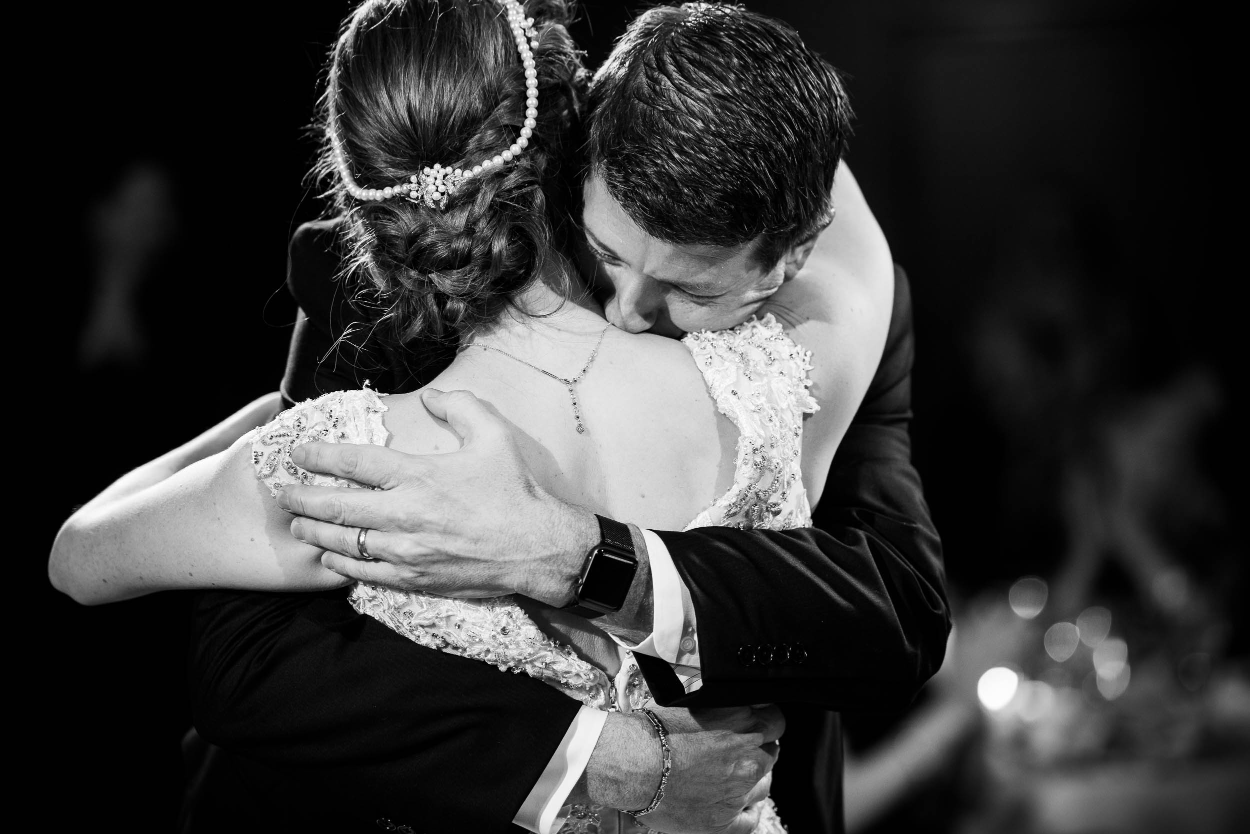 Father and daughter hug during a Newberry Library Chicago wedding.