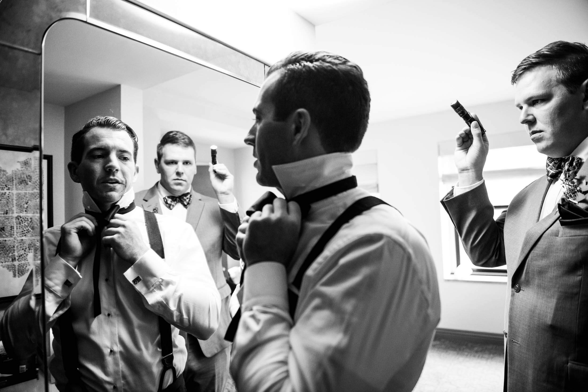 Groom and groomsmen getting ready during a Glessner House Chicago wedding.