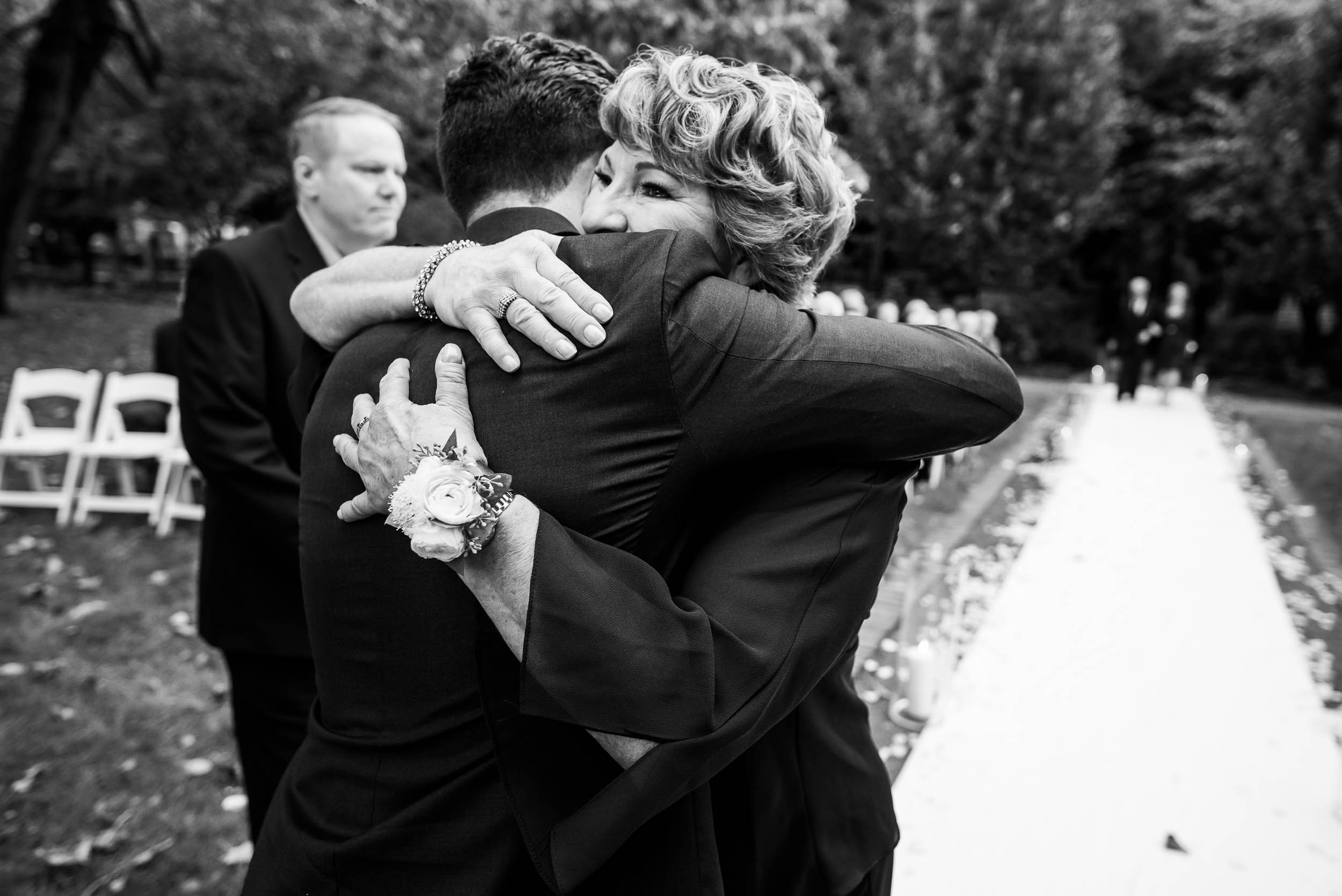 Groom and mom embrace during a Glessner House Chicago wedding.
