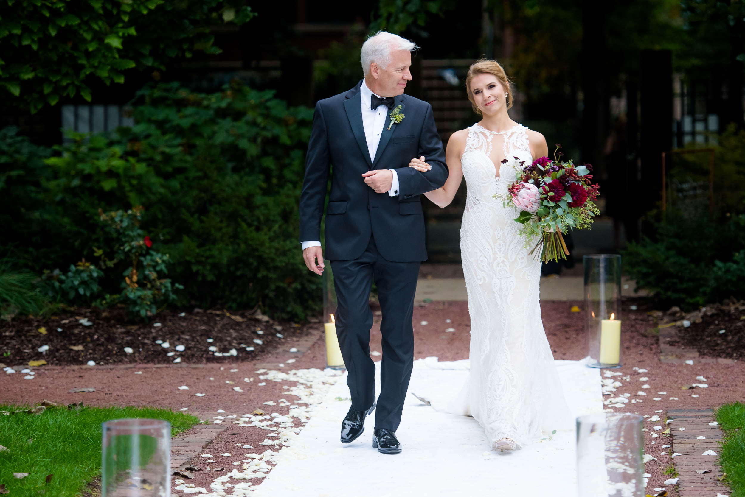 Father and bride walk down the aisle during a Glessner House Chicago wedding.