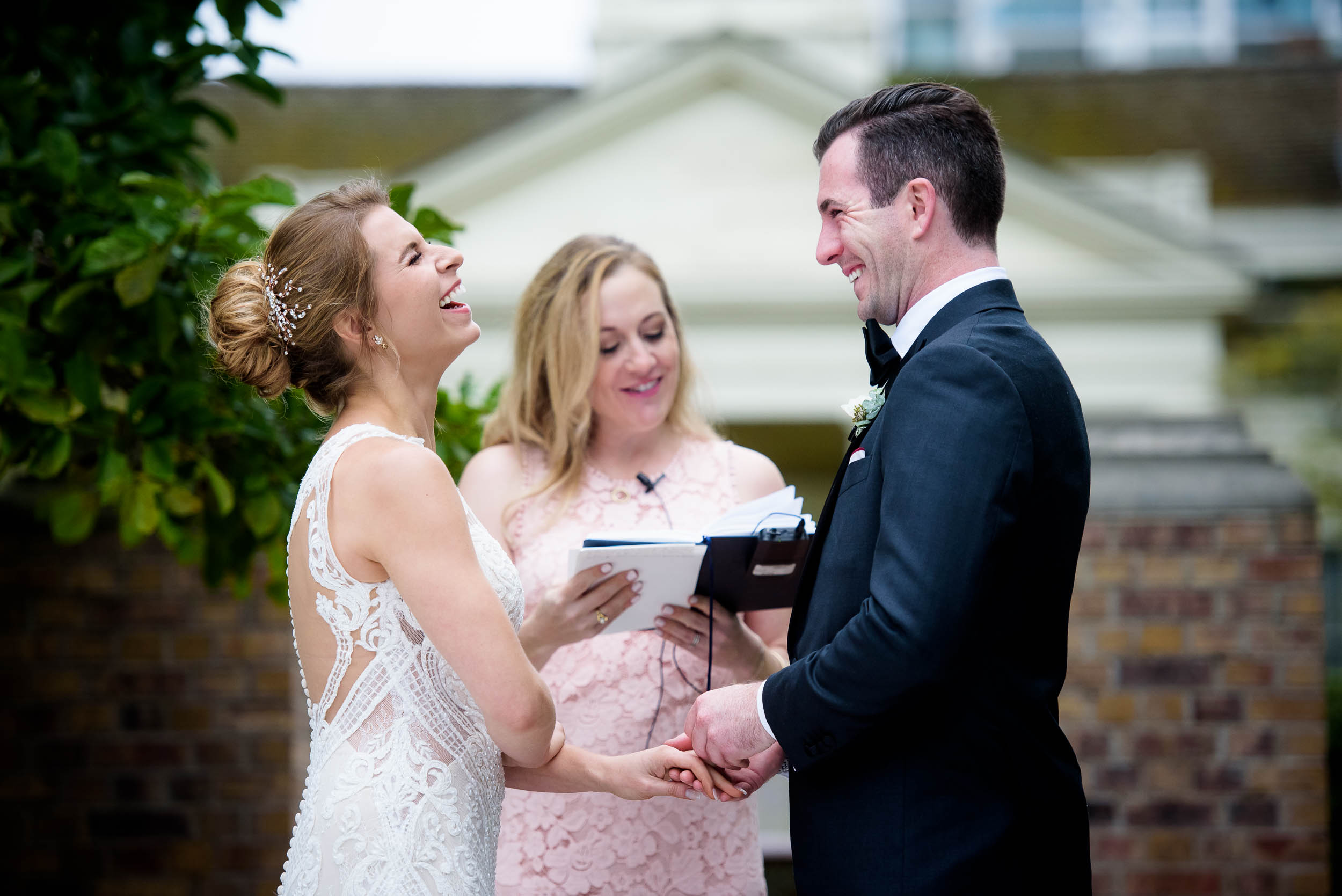 Bride and groom share a laugh during a Glessner House Chicago wedding ceremony.