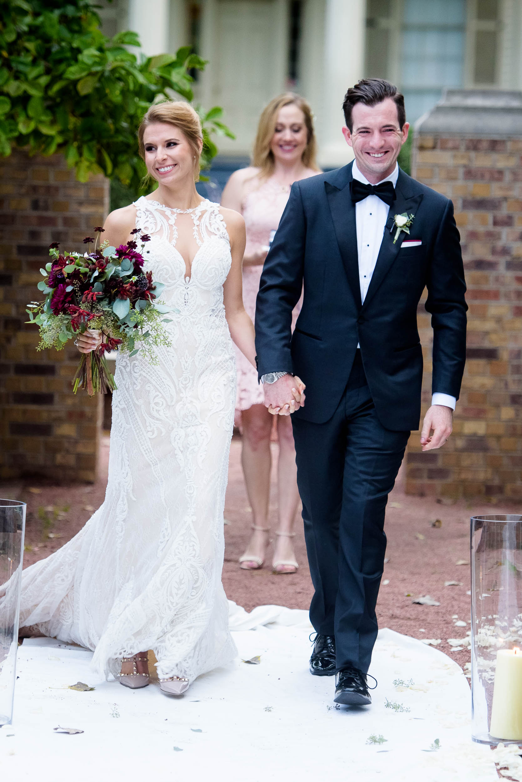 Bride and groom walk down the aisle during a Glessner House Chicago wedding ceremony.
