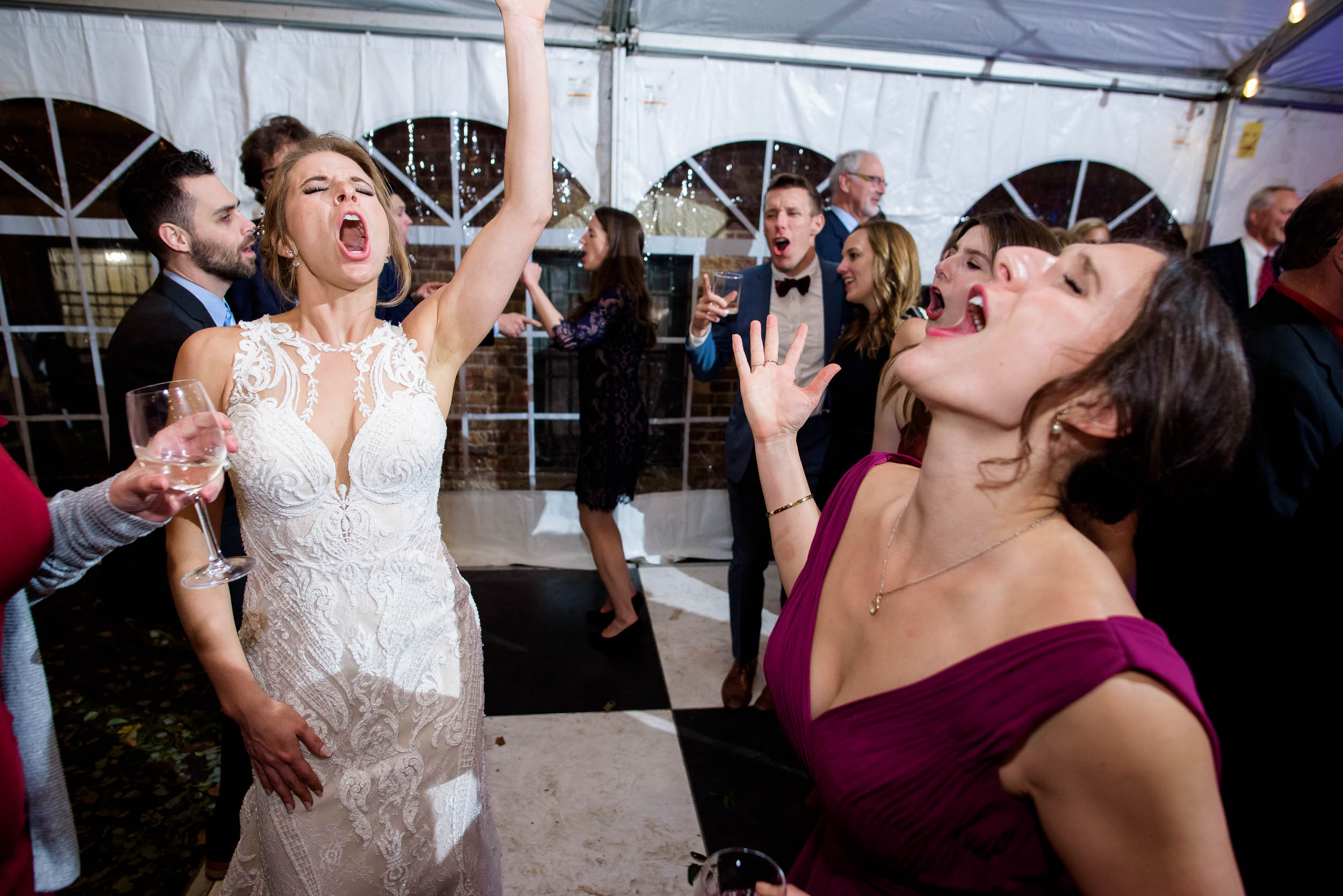 Bride and bridesmaid on the dance floor during a Glessner House Chicago wedding reception.