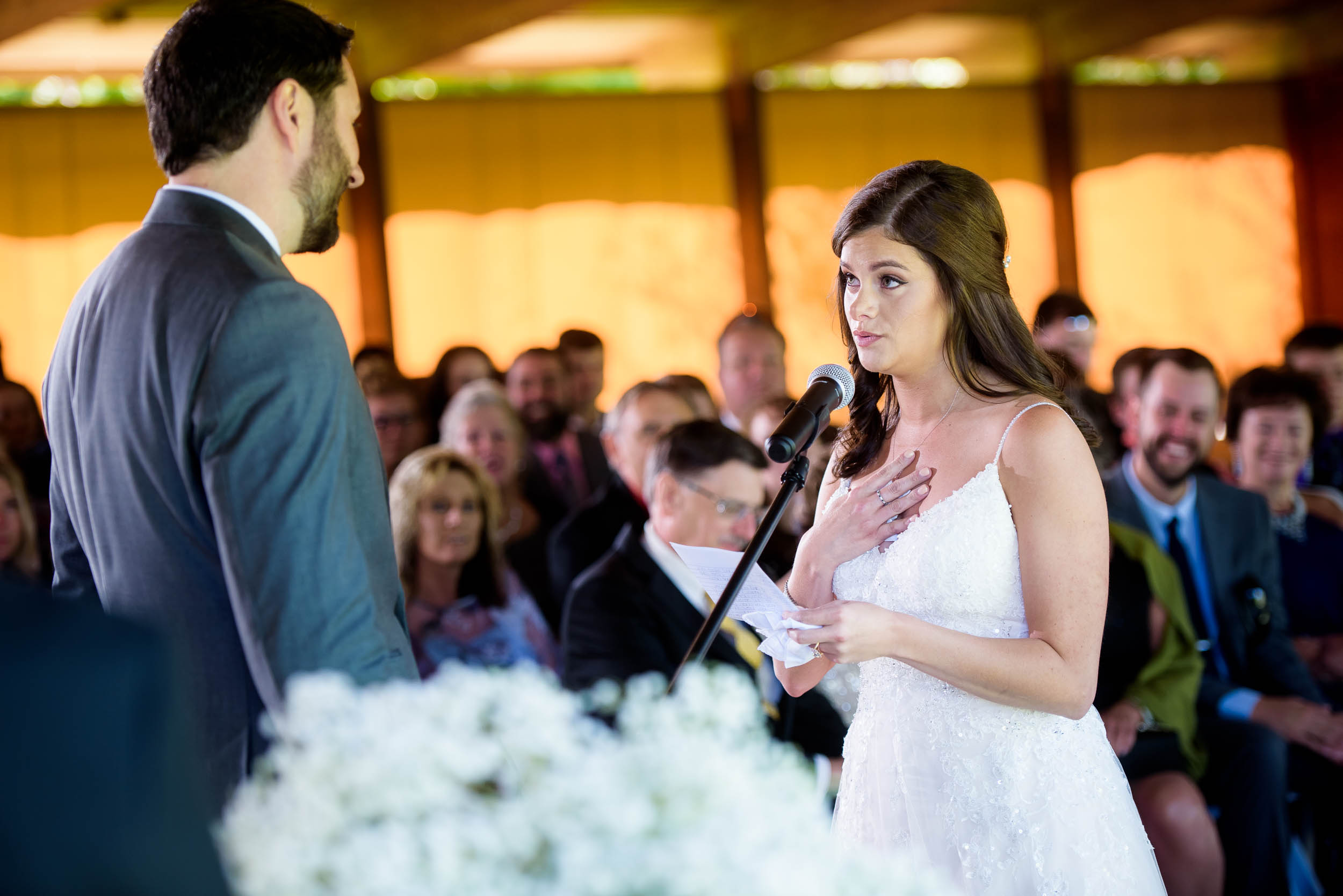 Bride and groom exchanging vows at Grand Geneve Resort Fall Chicago Wedding captured by J. Brown Photography. Visit jbrownphotography.com for more wedding inspiration!