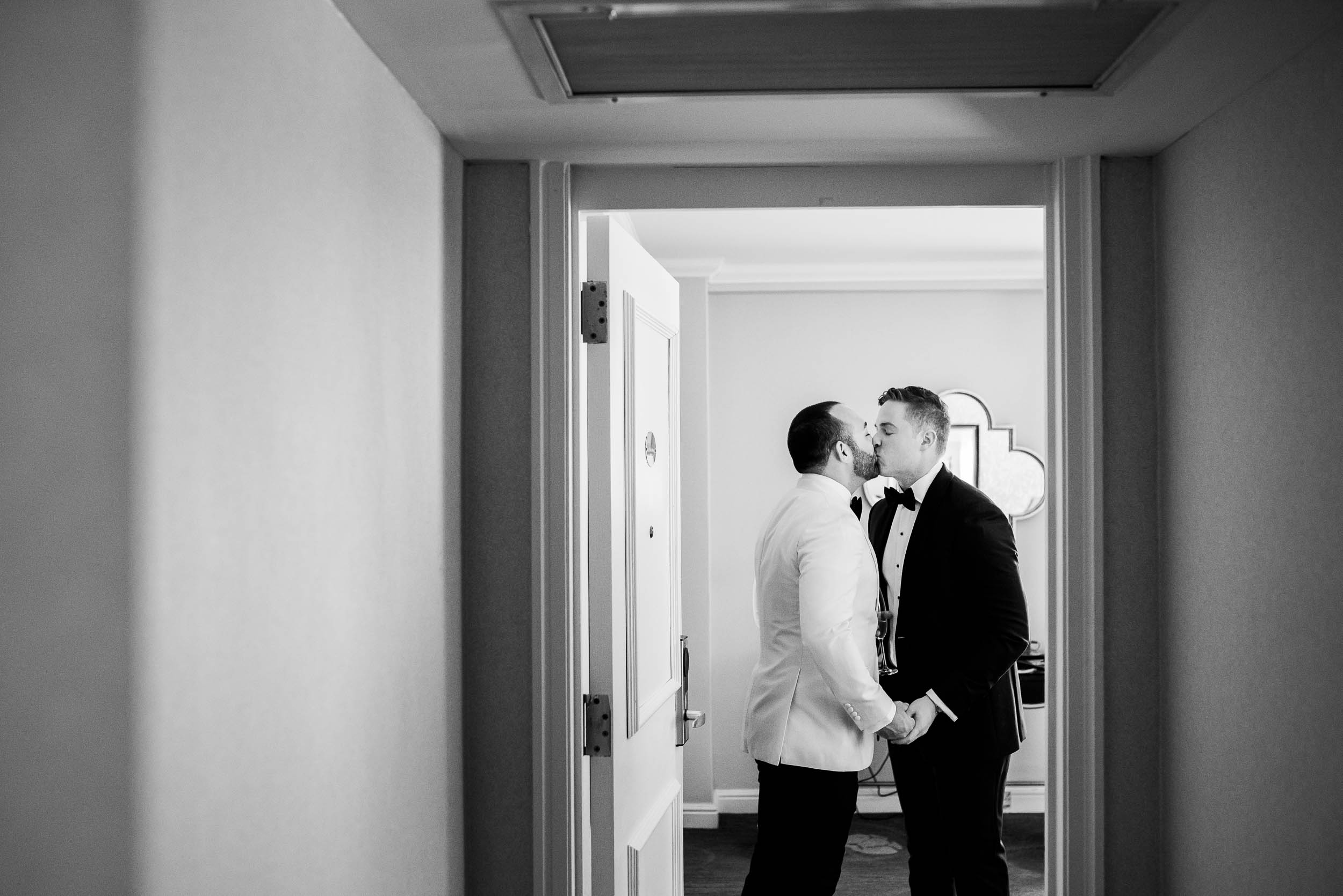 Grooms share a moment before luxurious fall wedding at the Chicago Symphony Center captured by J. Brown Photography. See more wedding ideas at jbrownphotography.com!