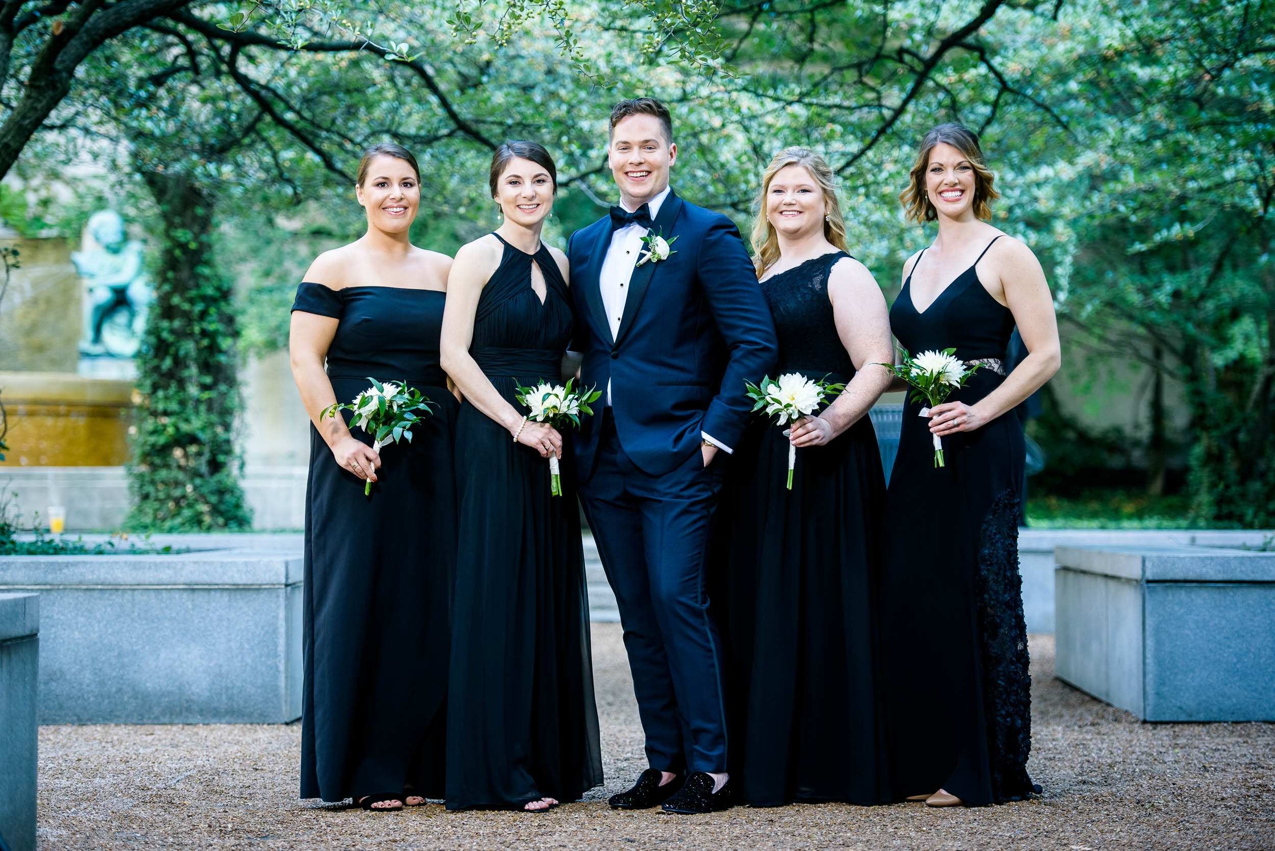 Groom posing with wedding party for luxurious fall wedding at the Chicago Symphony Center captured by J. Brown Photography. See more wedding ideas at jbrownphotography.com!