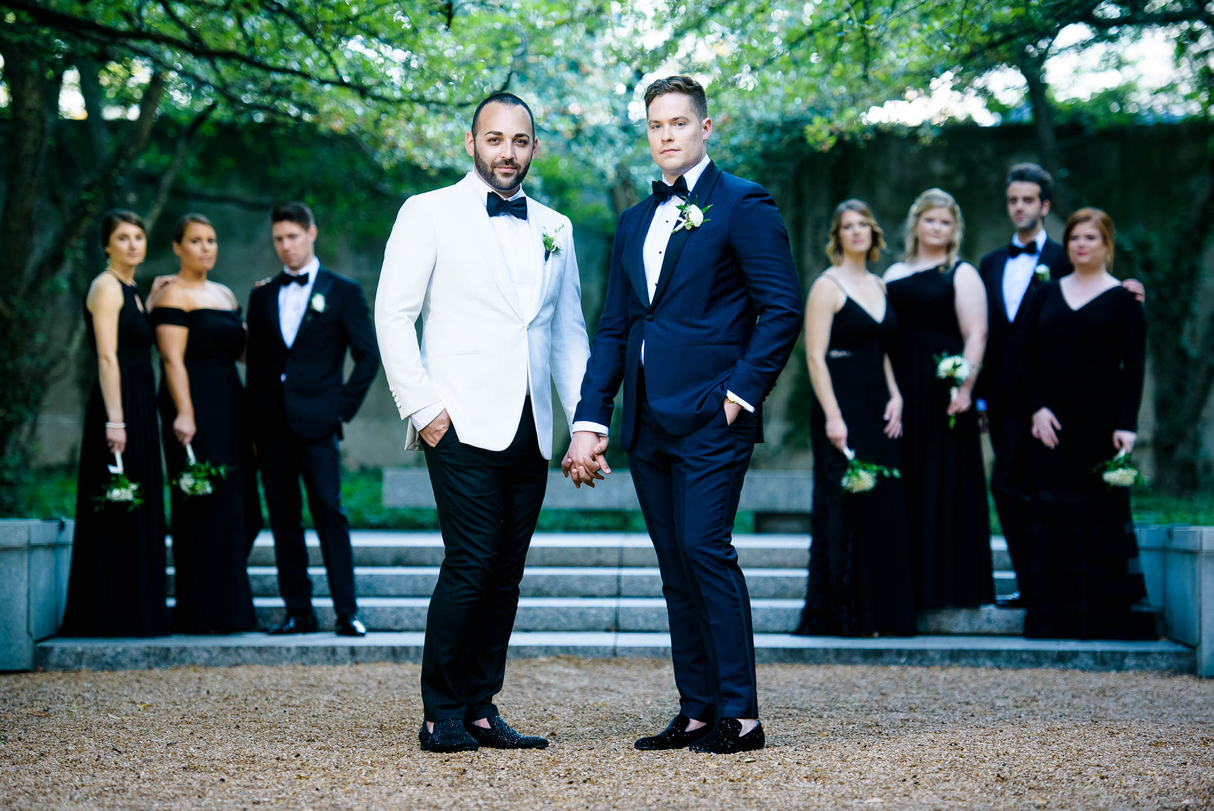 Grooms posing with wedding party for luxurious fall wedding at the Chicago Symphony Center captured by J. Brown Photography. See more wedding ideas at jbrownphotography.com!