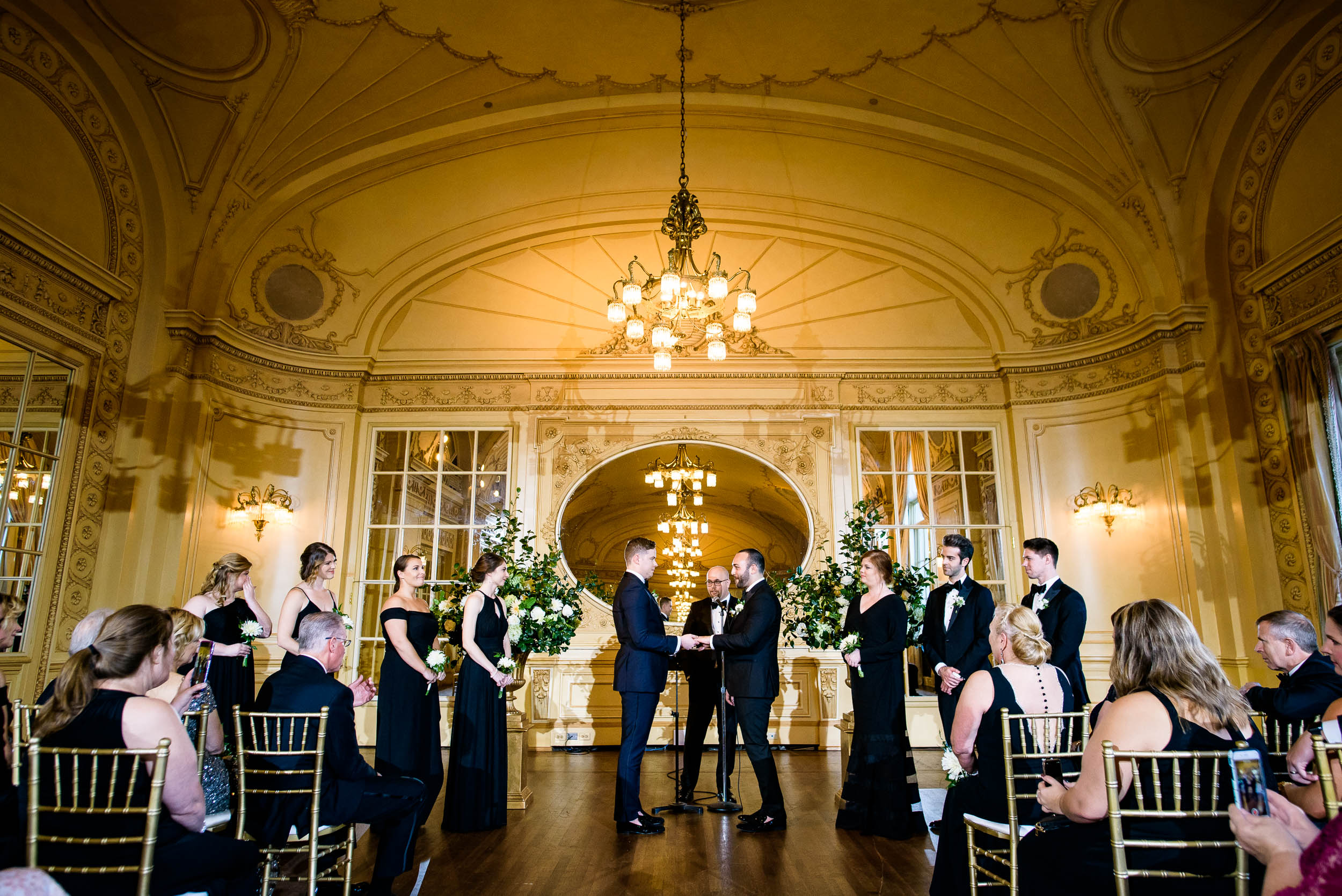 Grooms exchange their vows for luxurious fall wedding at the Chicago Symphony Center captured by J. Brown Photography. See more wedding ideas at jbrownphotography.com!