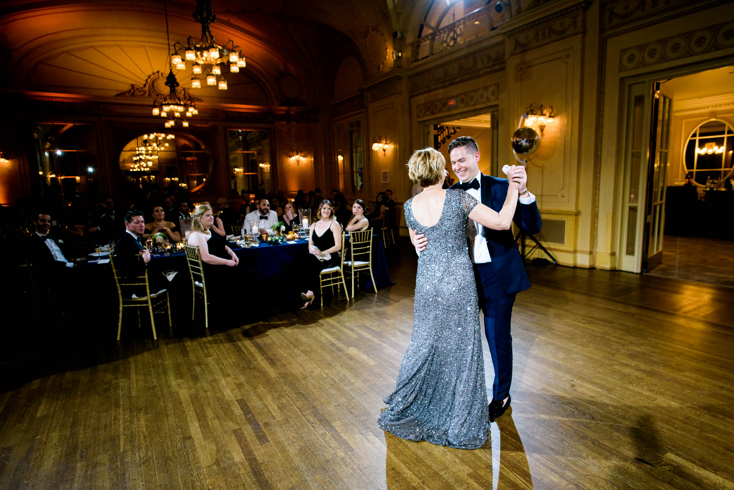 Mother and son dancing at luxurious fall wedding at the Chicago Symphony Center captured by J. Brown Photography. See more wedding ideas at jbrownphotography.com!