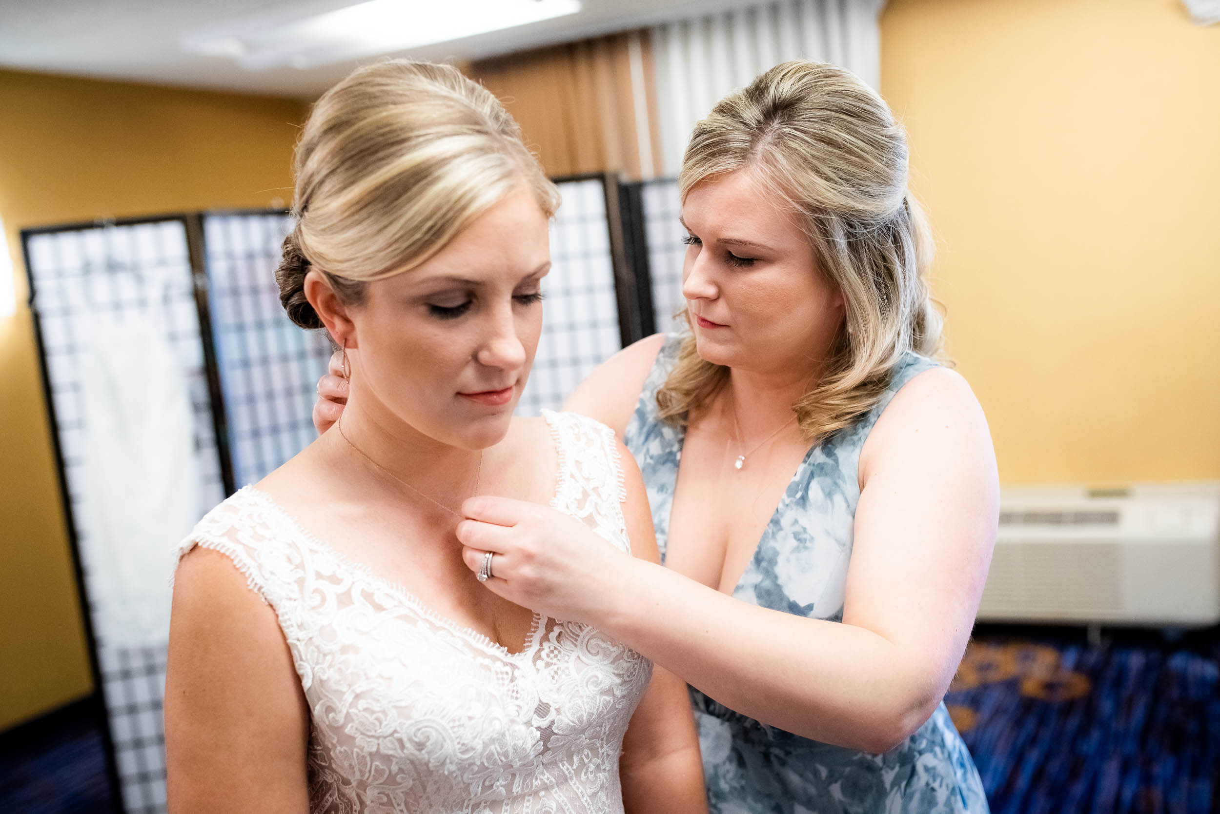 Bride getting ready: Modern industrial Chicago wedding inside Prairie Street Brewhouse captured by J. Brown Photography. Find more wedding ideas at jbrownphotography.com!