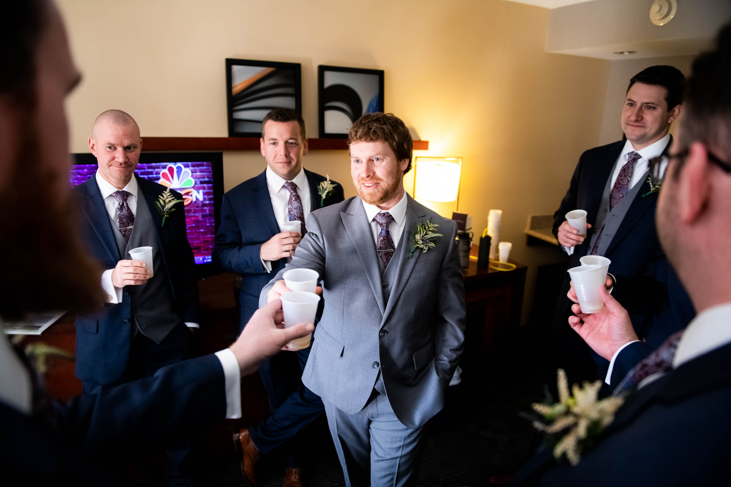 Groomsmen Toast: Modern industrial Chicago wedding inside Prairie Street Brewhouse captured by J. Brown Photography. Find more wedding ideas at jbrownphotography.com!