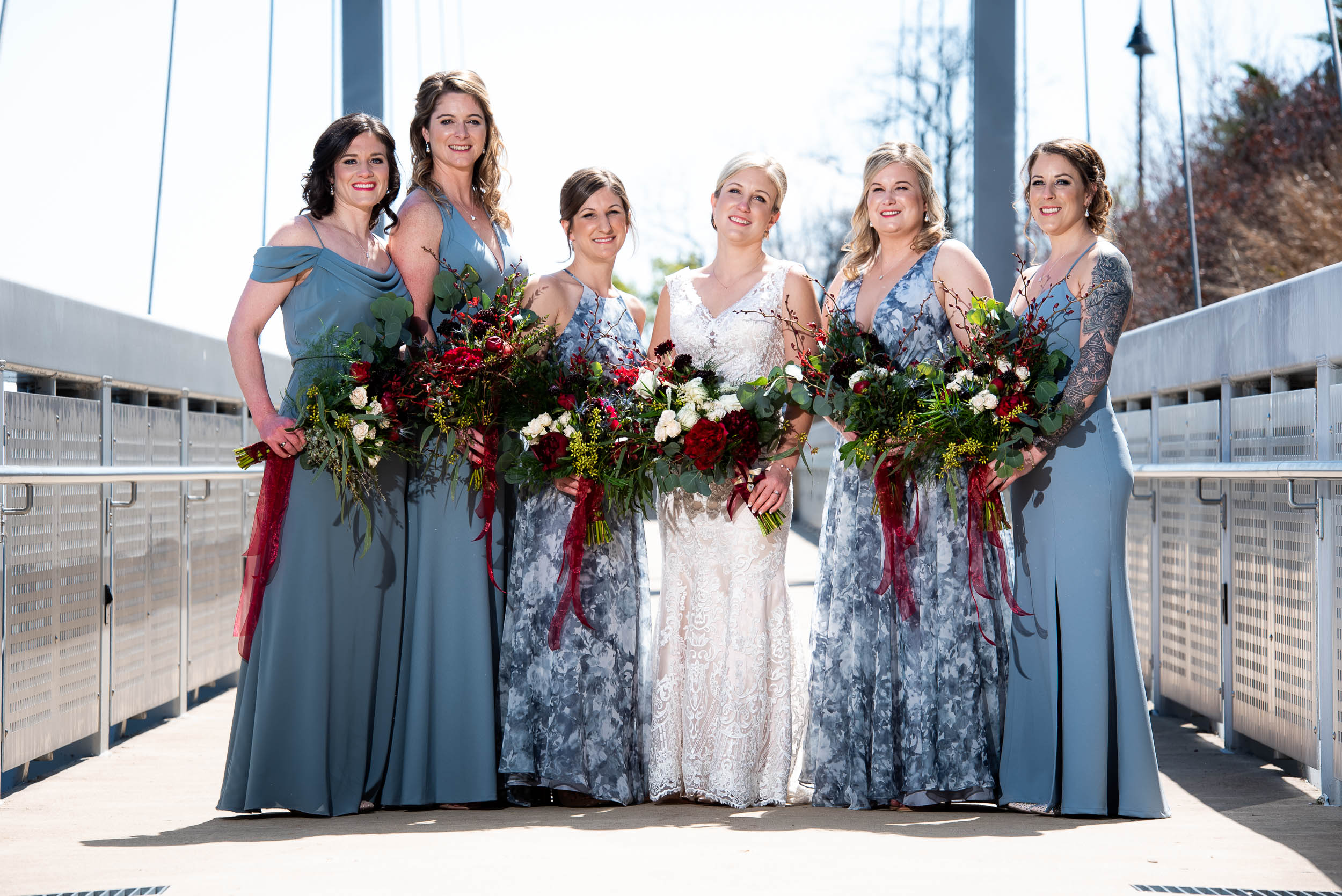 Blue bridesmaids dresses: Modern industrial Chicago wedding inside Prairie Street Brewhouse captured by J. Brown Photography. Find more wedding ideas at jbrownphotography.com!