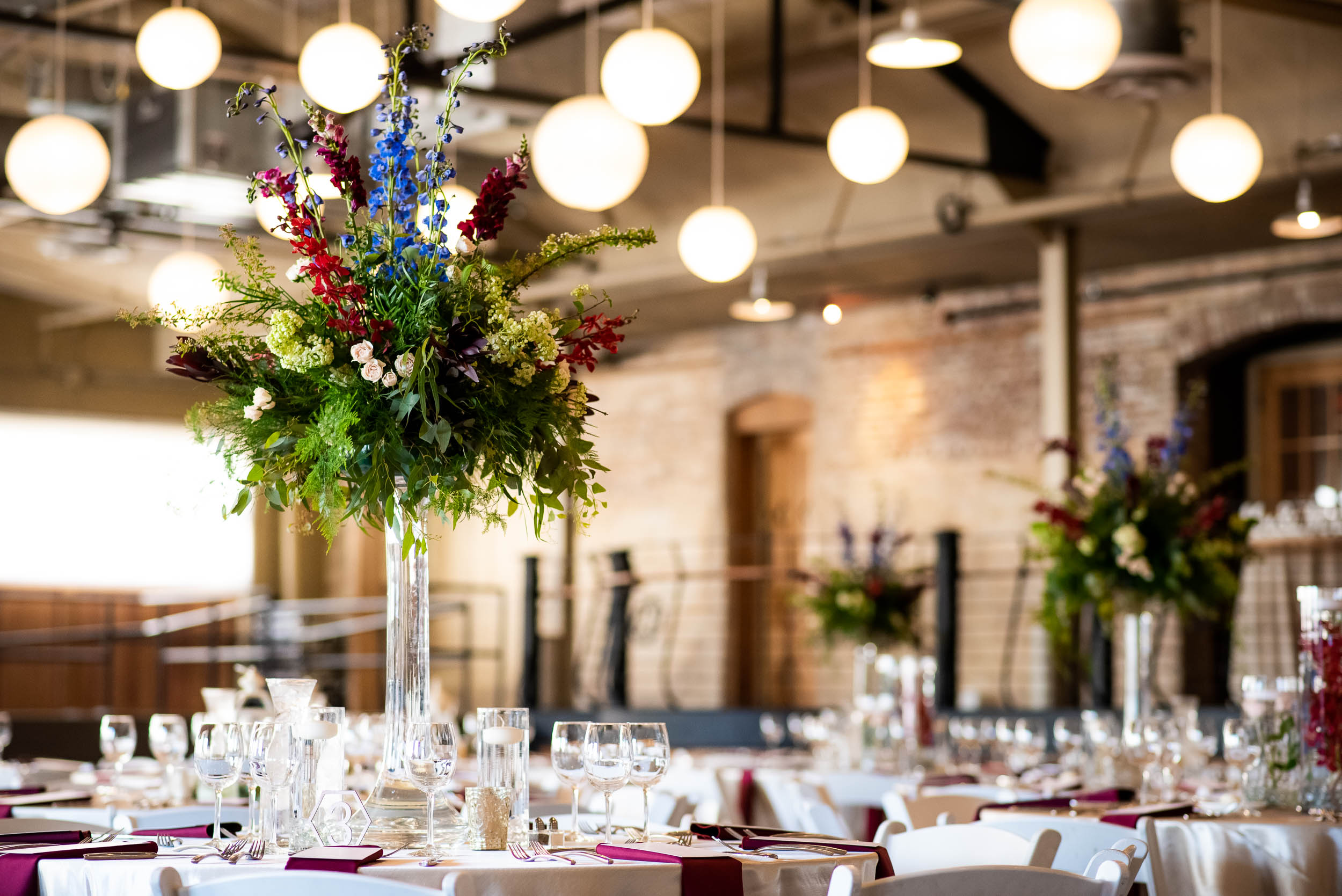 Wedding reception decor: Modern industrial Chicago wedding inside Prairie Street Brewhouse captured by J. Brown Photography. Find more wedding ideas at jbrownphotography.com!