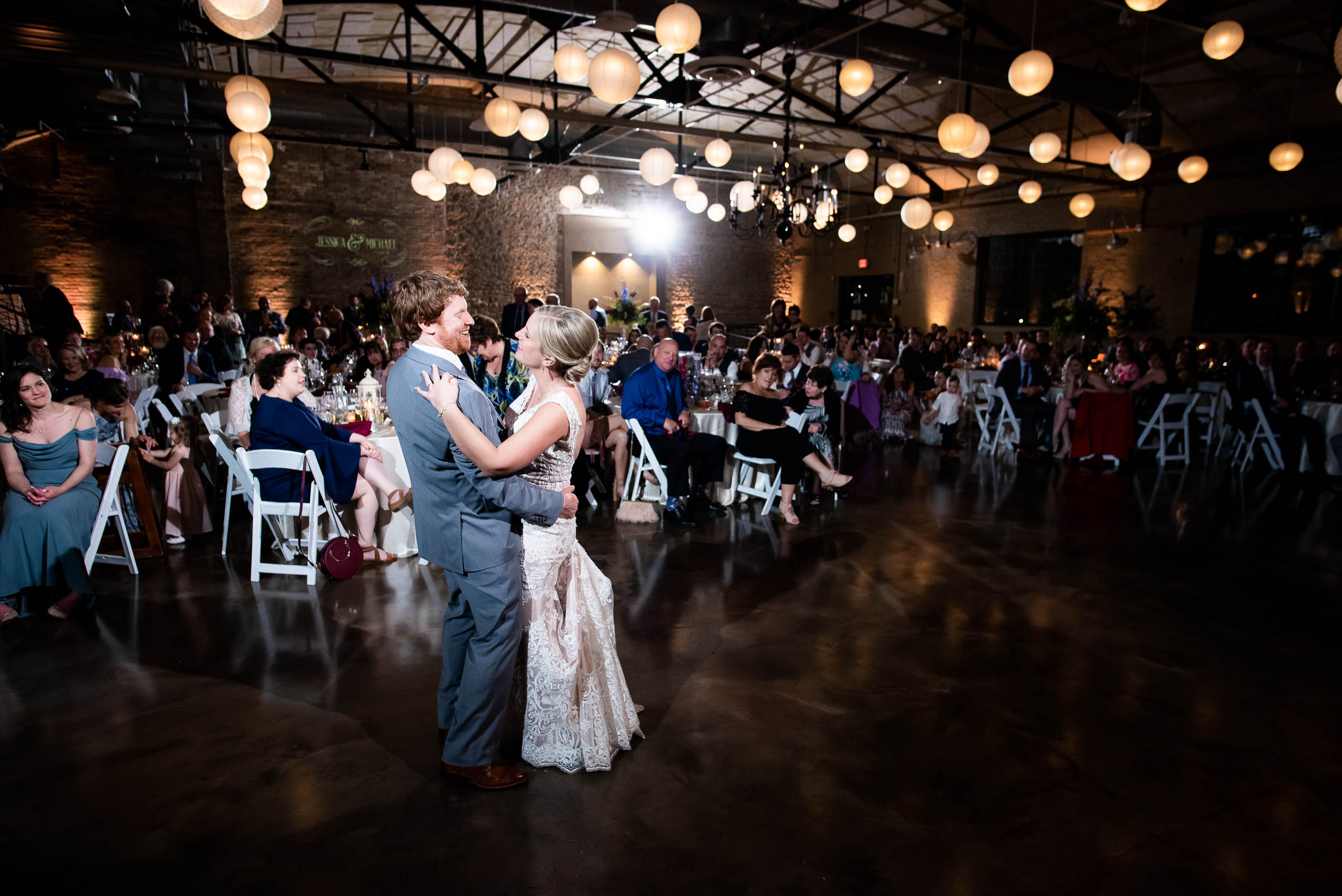 Wedding dancing: Modern industrial Chicago wedding inside Prairie Street Brewhouse captured by J. Brown Photography. Find more wedding ideas at jbrownphotography.com!