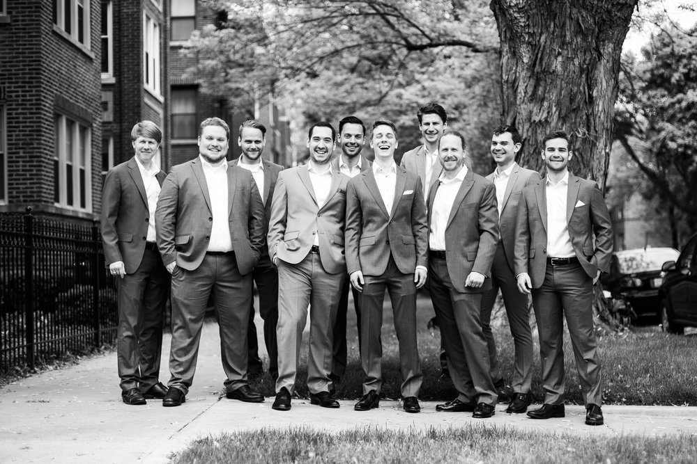 Groom and groomsmen pose for wedding photos for Carnivale Chicago wedding captured by J Brown Photography