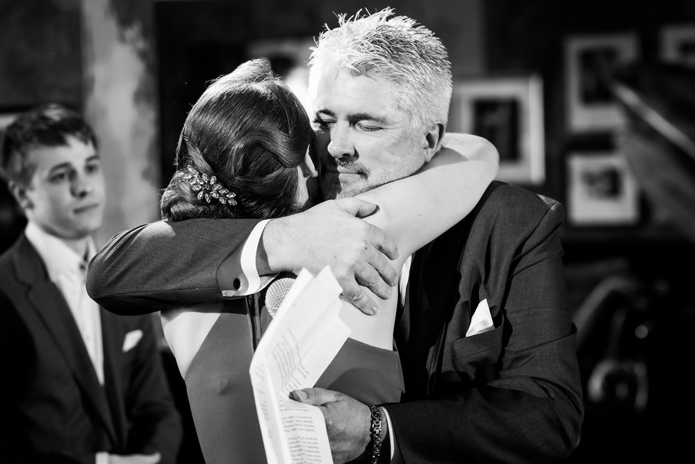 Father of the bride and the bride sharing a hug: Carnivale Chicago wedding captured by J Brown Photography
