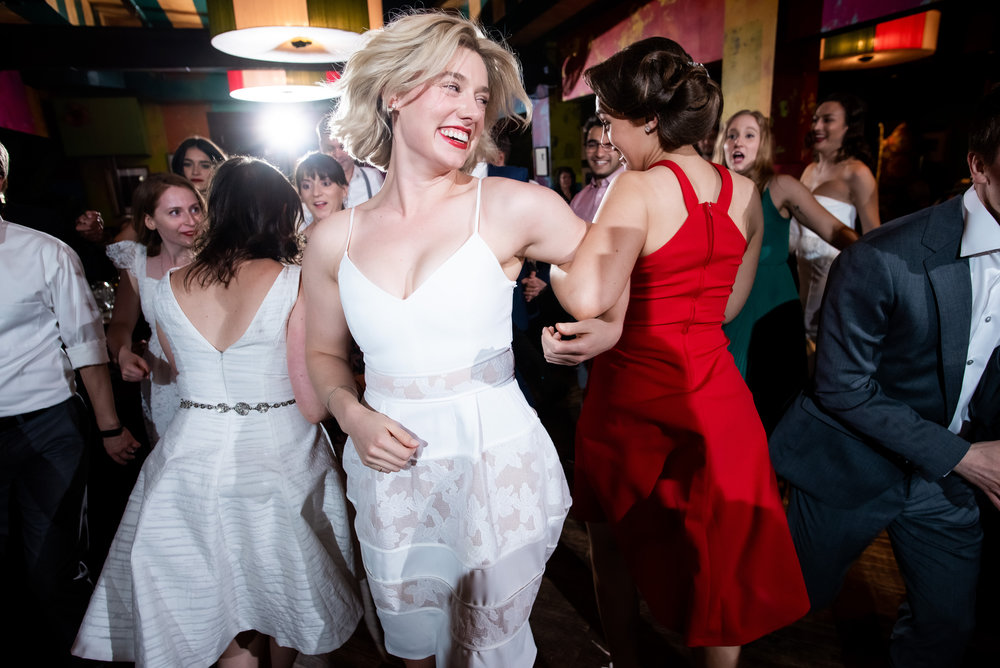 Wedding guests dancing during Carnivale Chicago wedding captured by J Brown Photography
