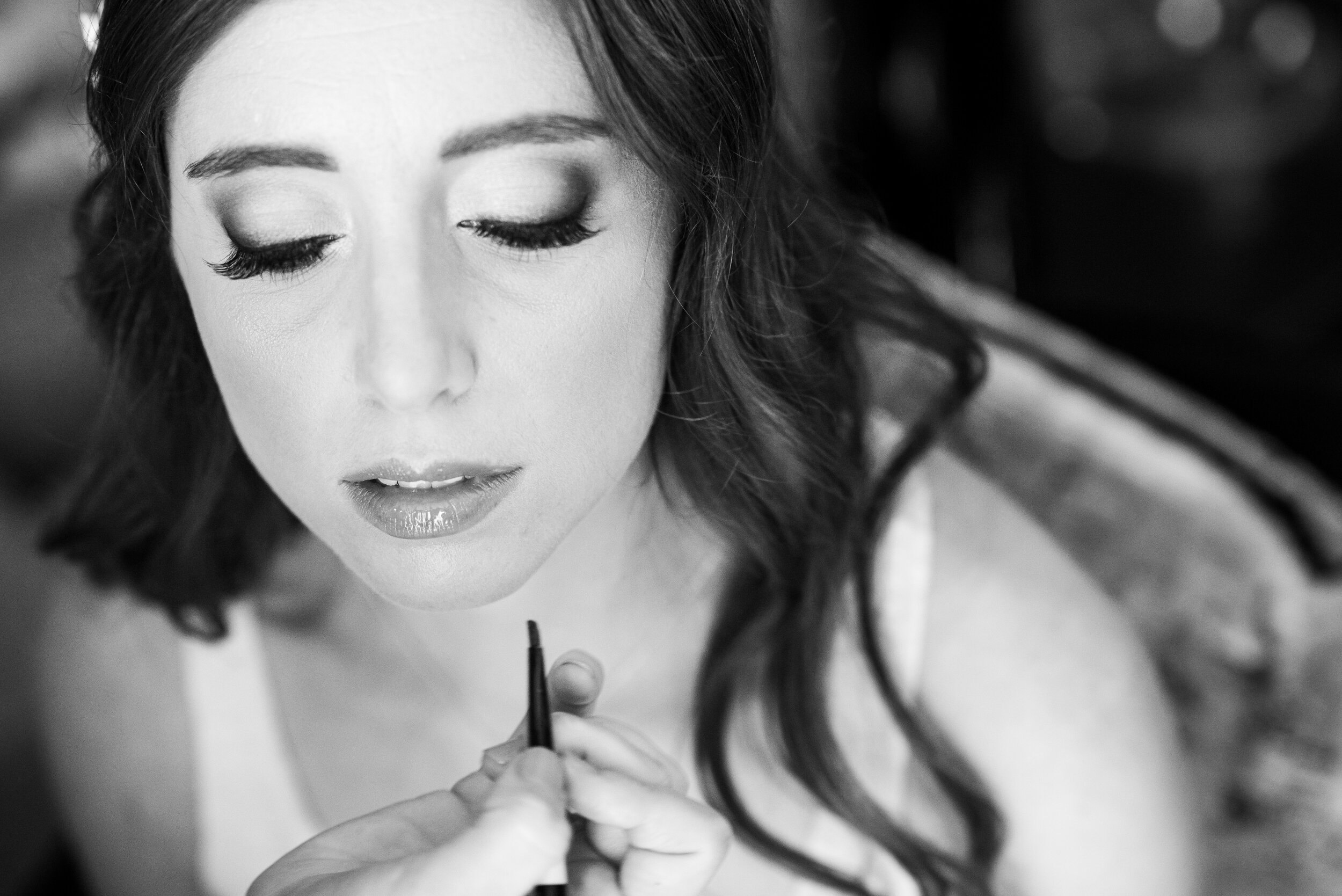 Bride getting makeup done: Loews Chicago Hotel Wedding captured by J. Brown Photography