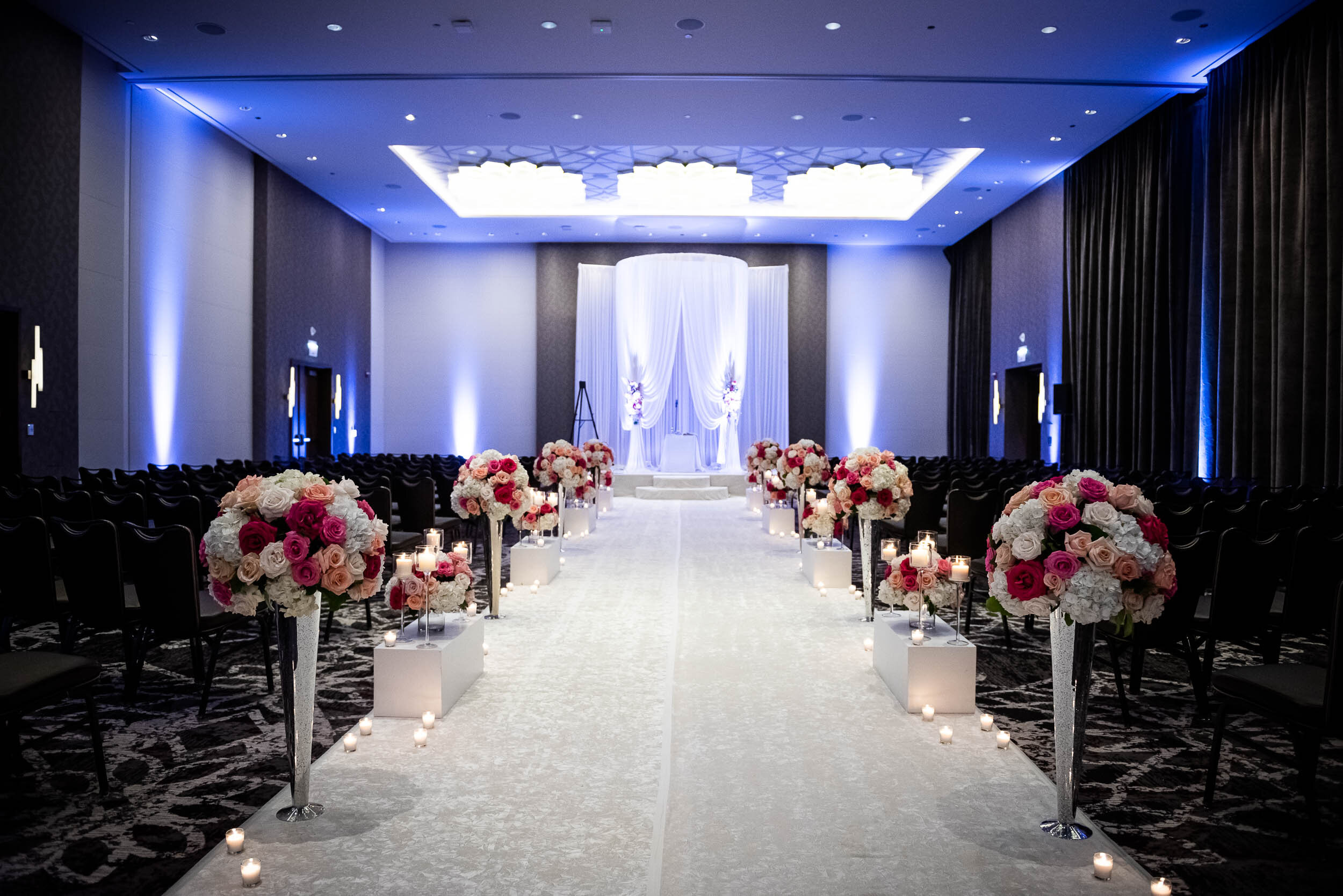 Indoor wedding ceremony decor: Loews Chicago Hotel Wedding captured by J. Brown Photography