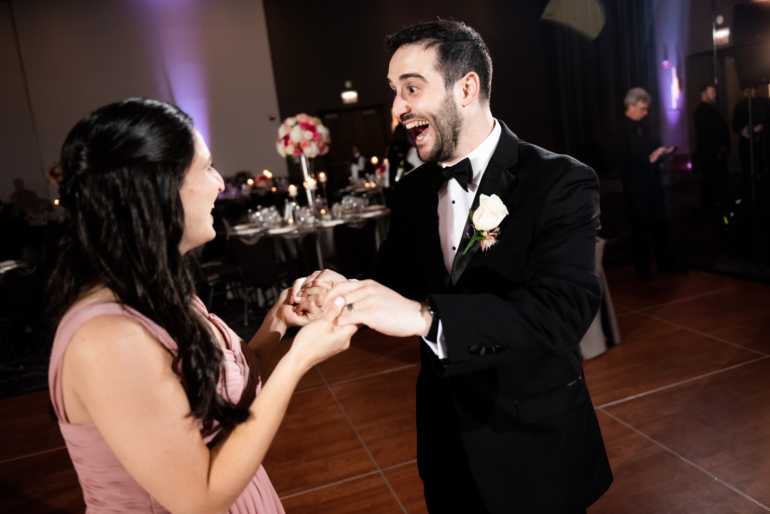 Groom and bridesmaid dancing: Loews Chicago Hotel Wedding captured by J. Brown Photography