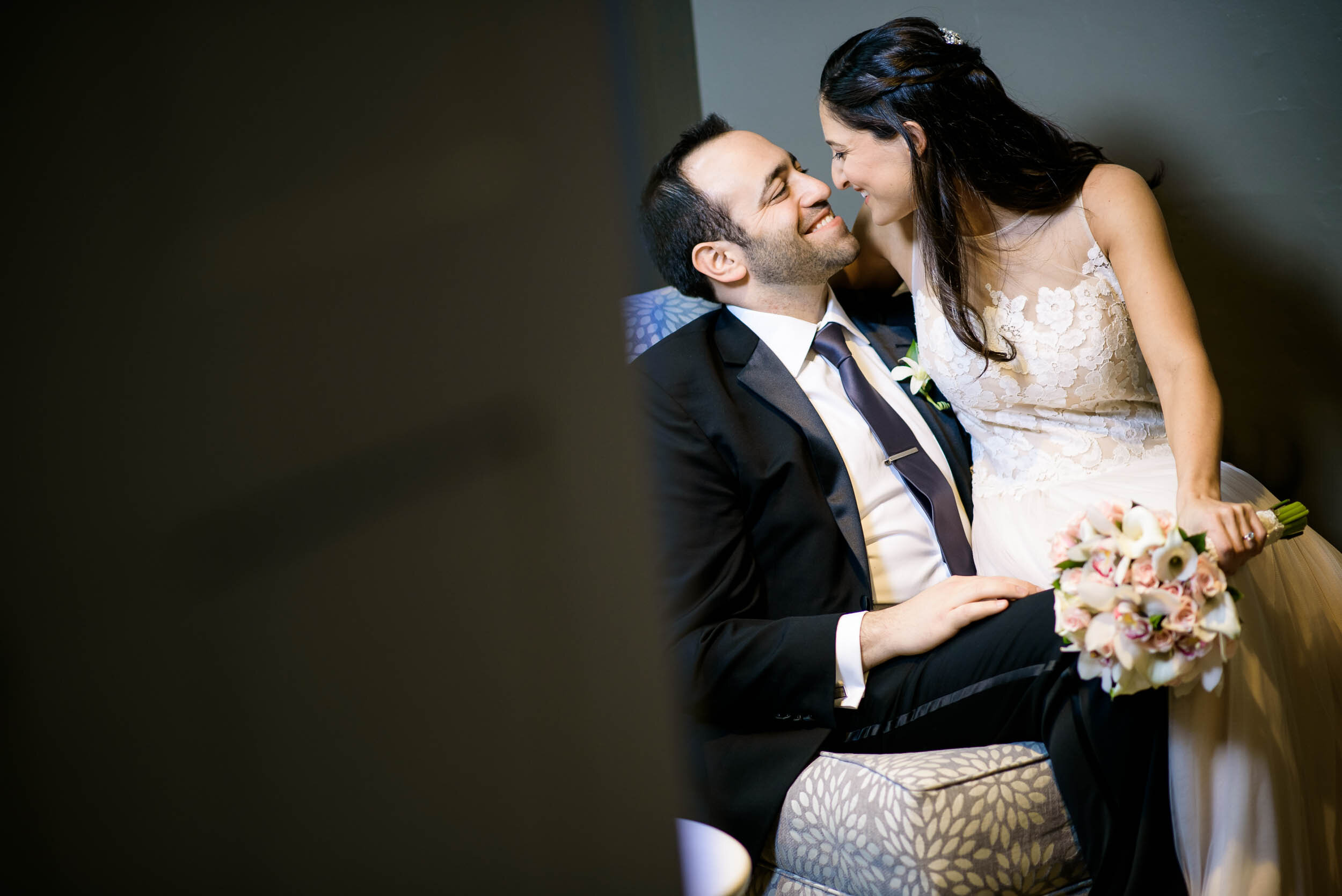 Indoor wedding portrait of the bride and groom during a Chevy Chase Country Club wedding by J. Brown Photography.