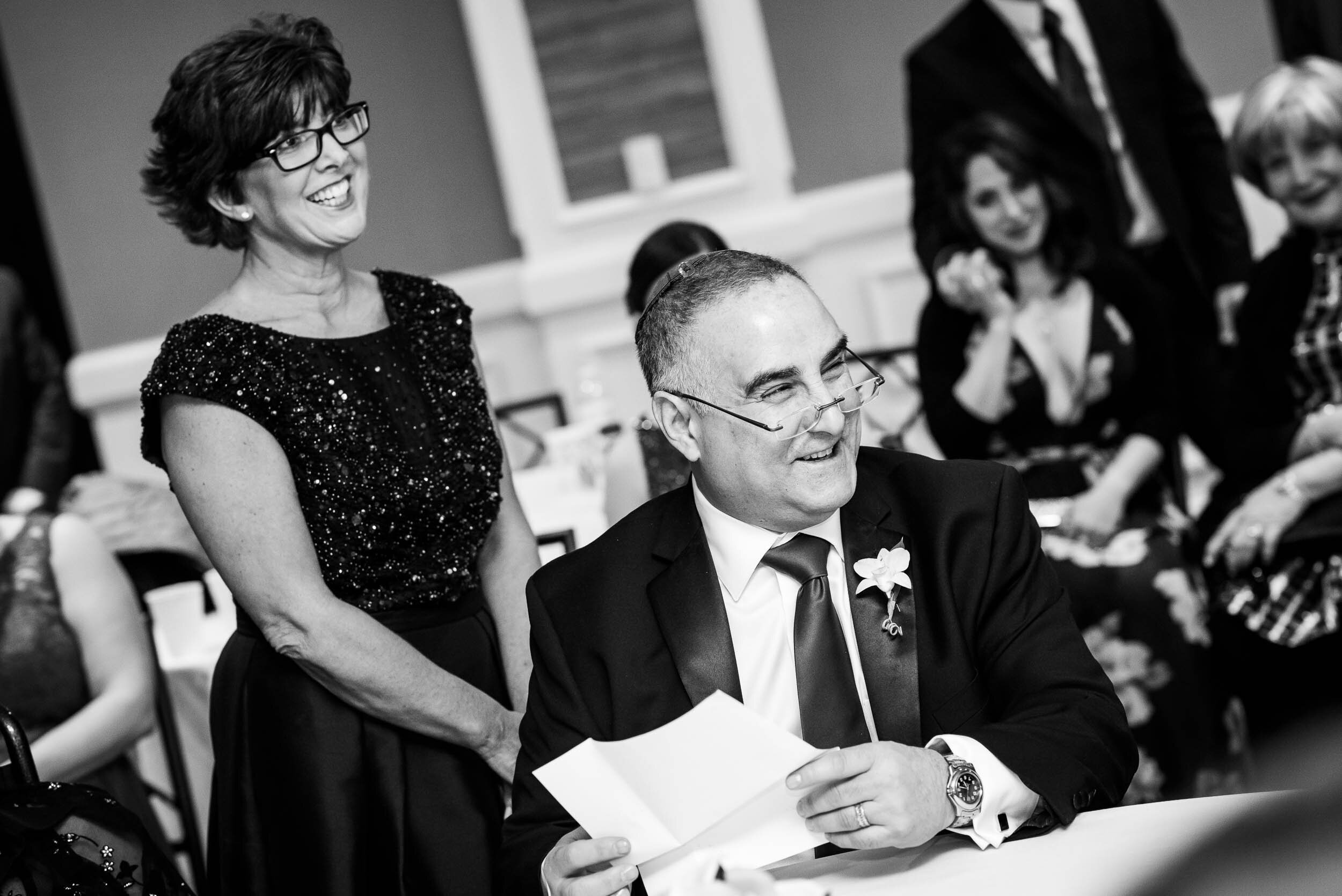 Parents of bride at Jewish wedding ketubah signing during a Chevy Chase Country Club wedding by J. Brown Photography.