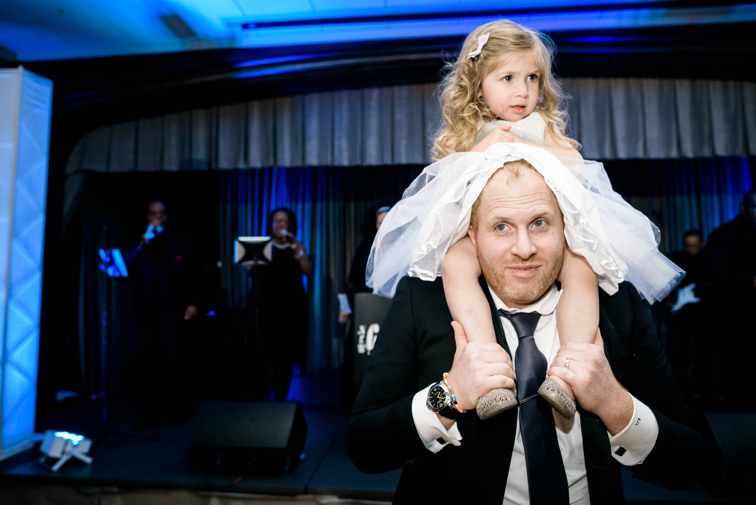 Funny flower girl on dance floor during a Chevy Chase Country Club jewish wedding by J. Brown Photography.