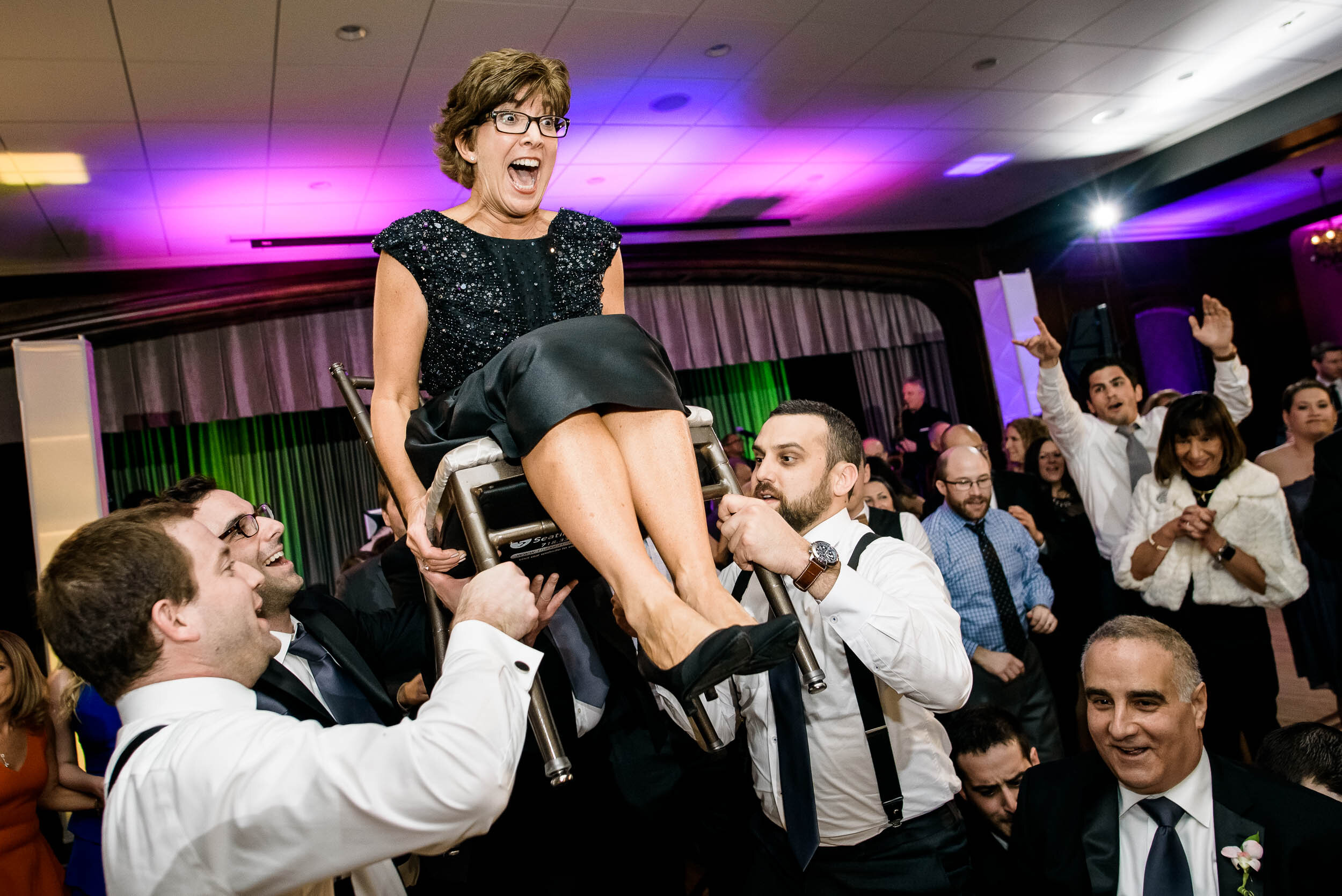 Mother of the bride hora dance during a Chevy Chase Country Club jewish wedding by J. Brown Photography.