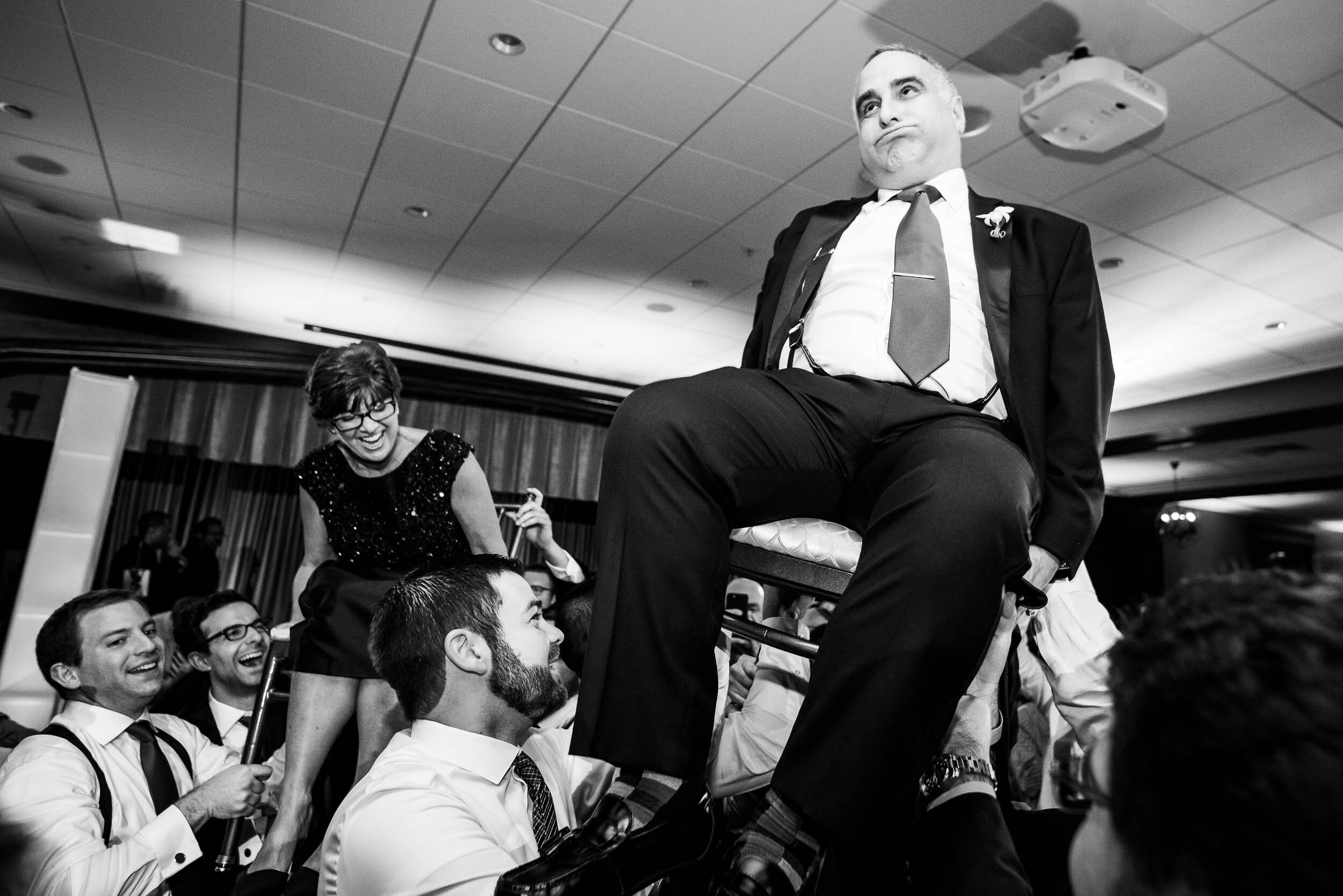 Father of the bride hora dance during a Chevy Chase Country Club jewish wedding by J. Brown Photography.
