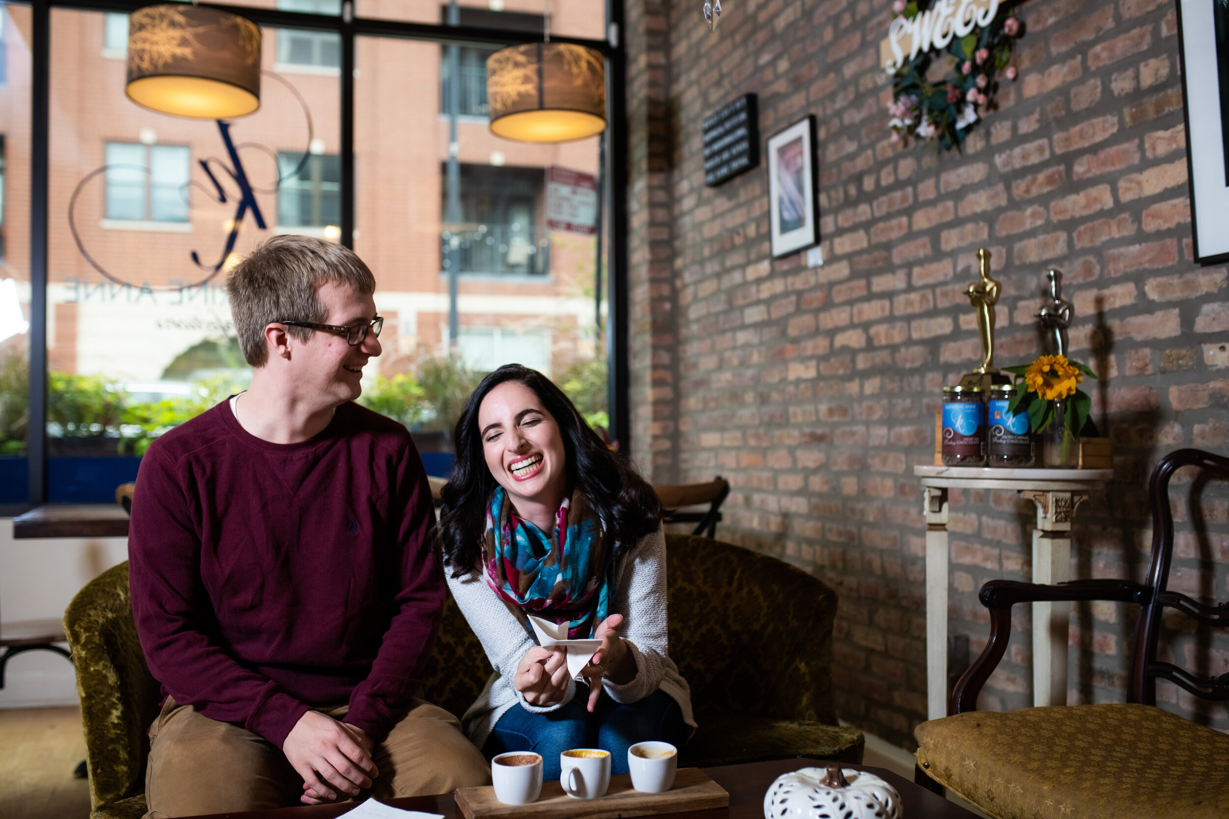 Funny engagement session moment at Katherine Anne Confections in Logan Square.
