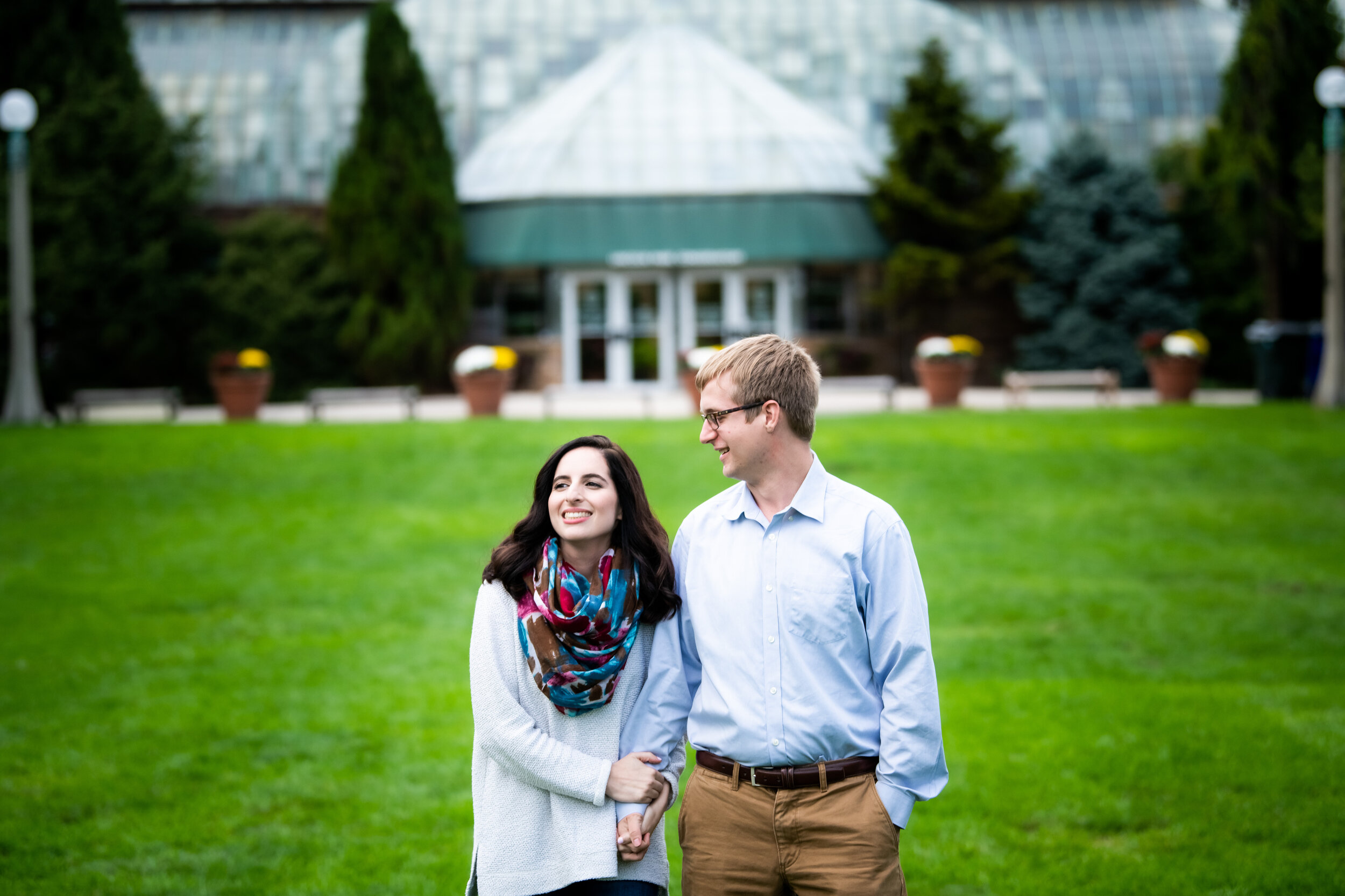 Creative and fun engagement photo at the Lincoln Park Conservatory Chicago. 