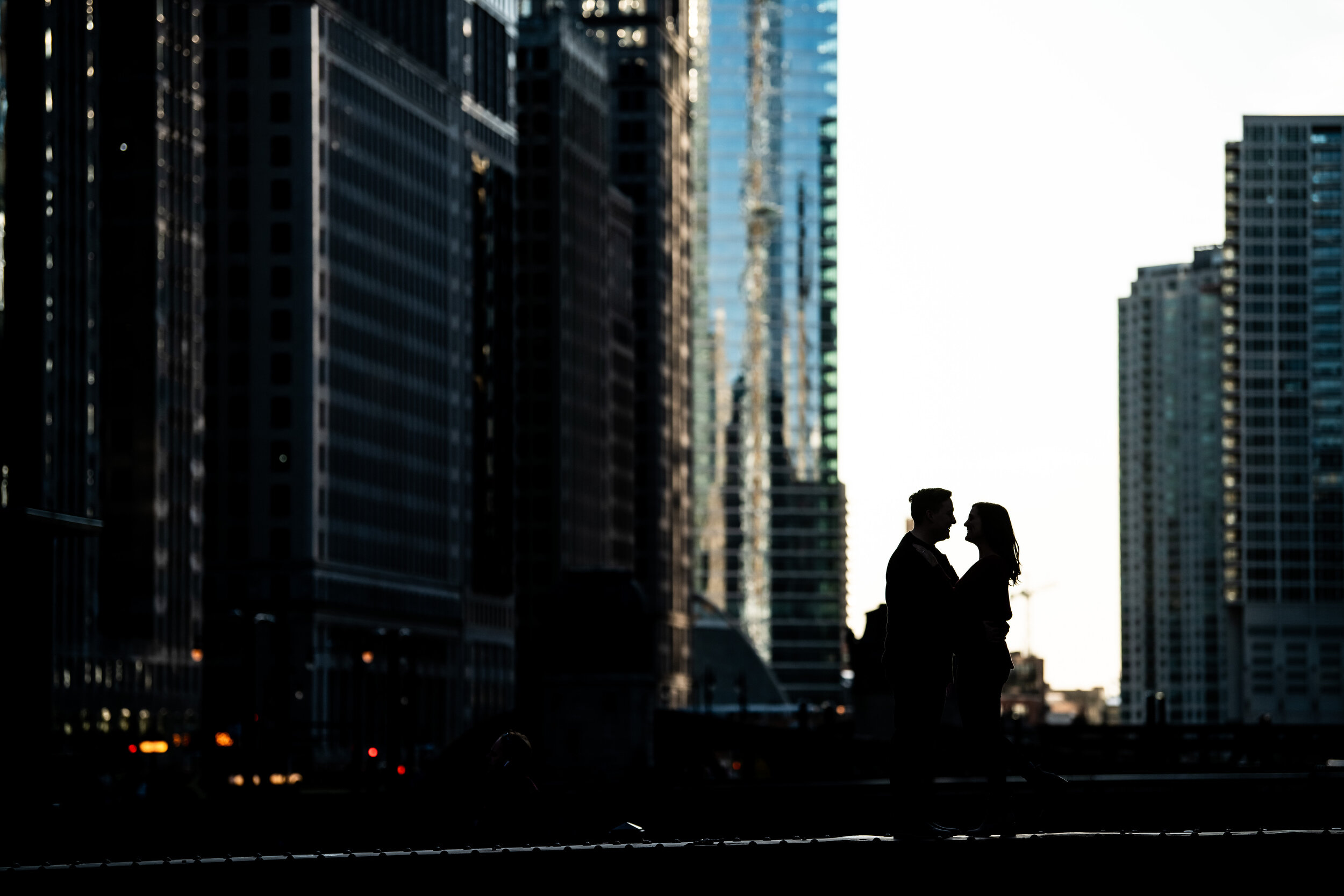 Creative silhouette engagement photo on the Chicago bridges.