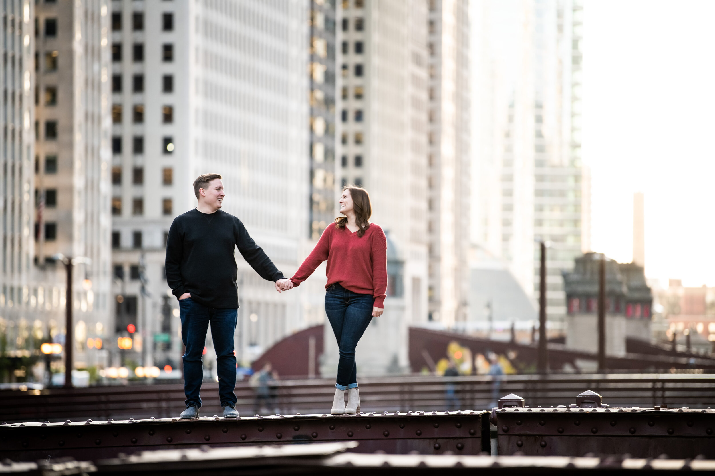 Unique engagement photo of bride and groom on the Chicago bridge.