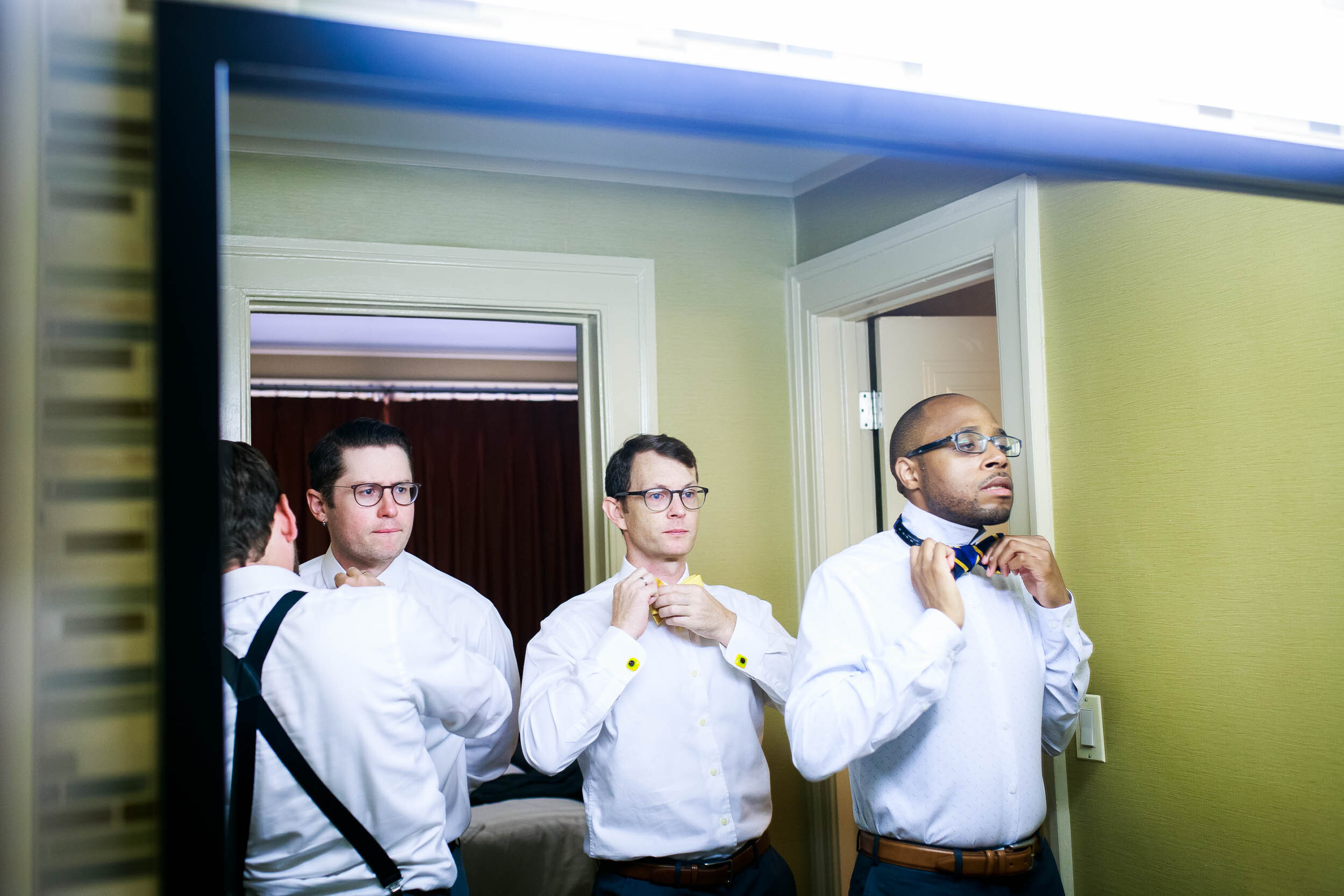 Groomsmen getting ready photo: Columbus Park Refectory wedding captured by J. Brown Photography.