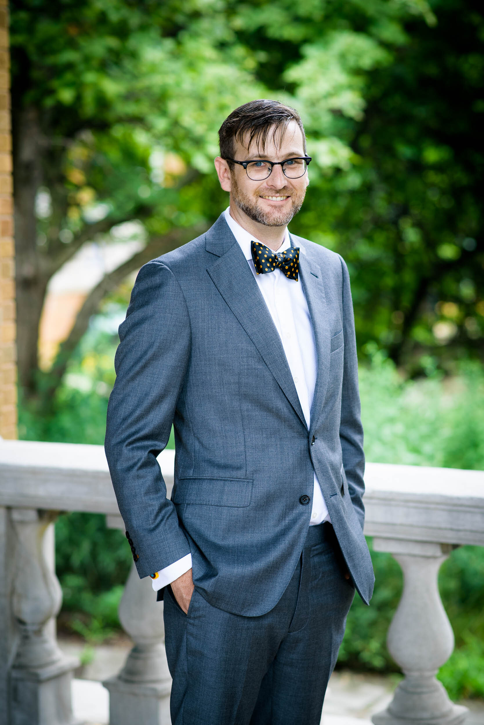 Outdoor portrait of the groom: Columbus Park Refectory Chicago wedding captured by J. Brown Photography.