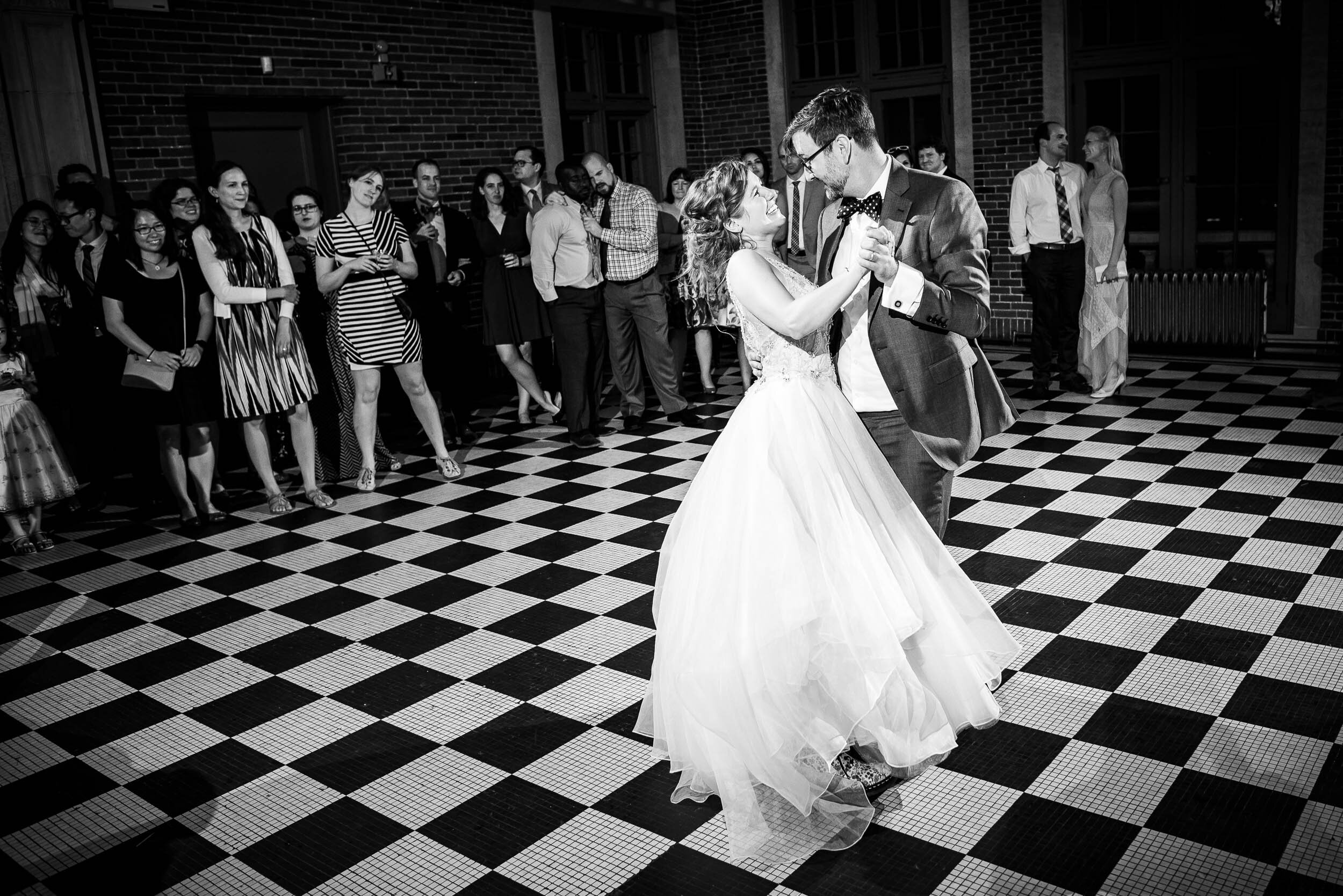 Bride and groom first dance: Columbus Park Refectory Chicago wedding captured by J. Brown Photography.